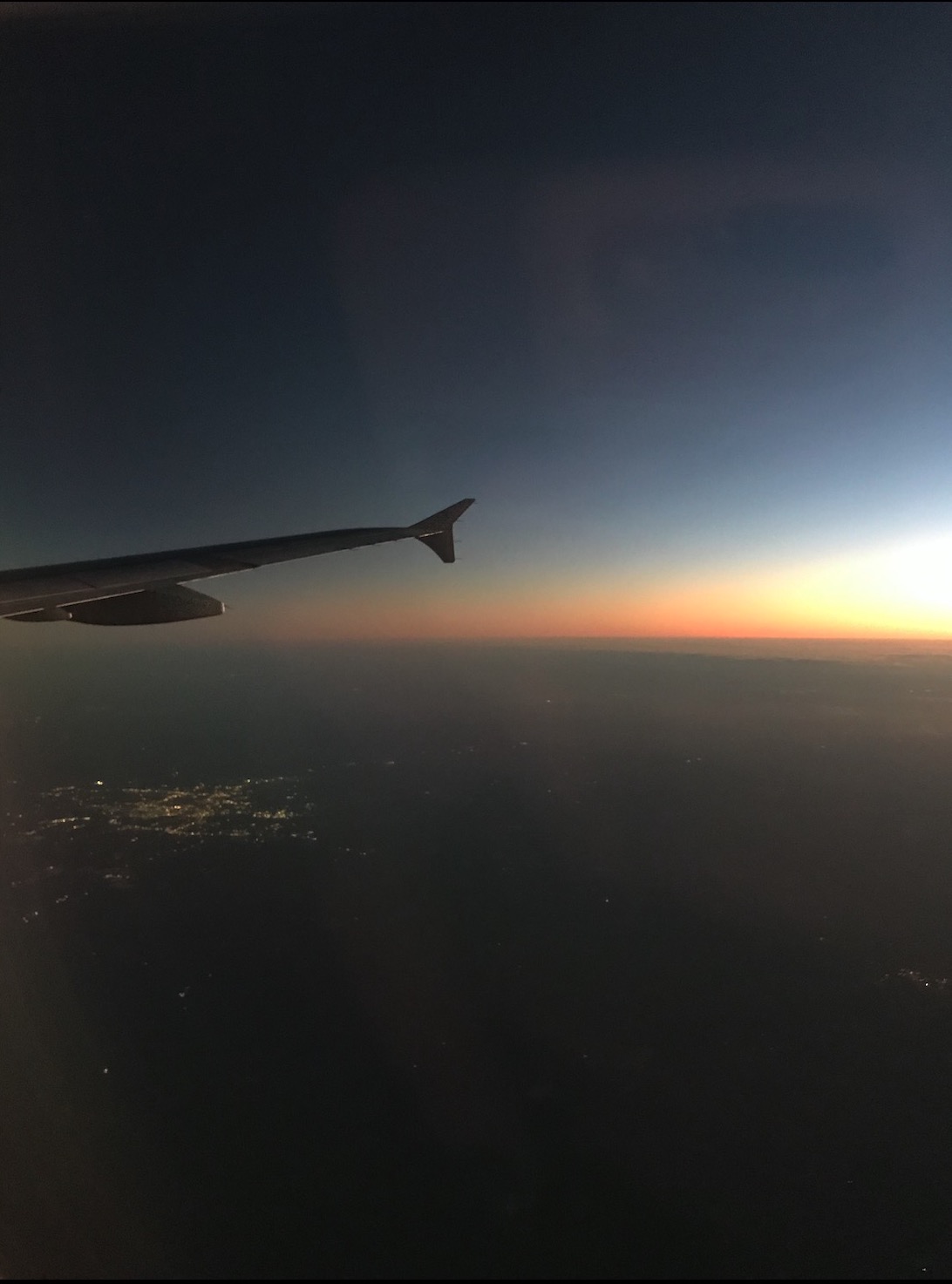 plane flying during sunset