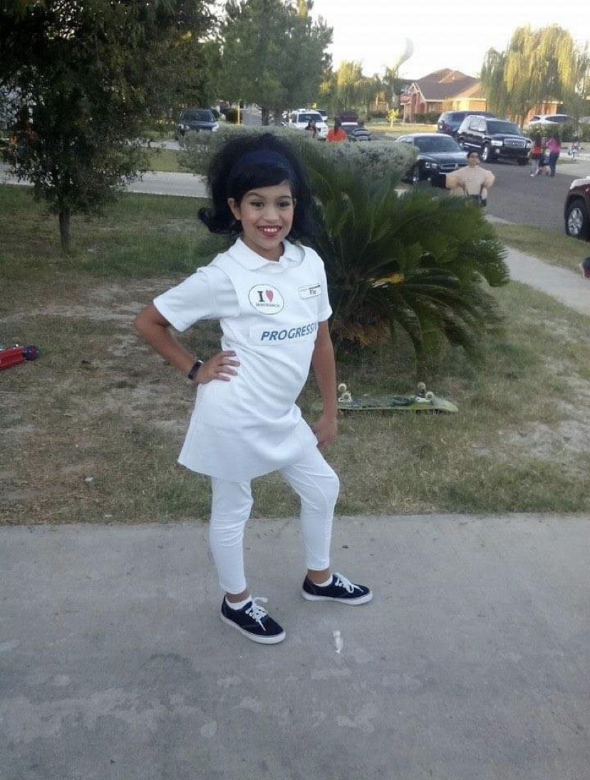 Little girl dressed as insurance lady