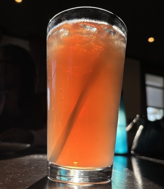 Red-orange colored drink photographed in coffee house