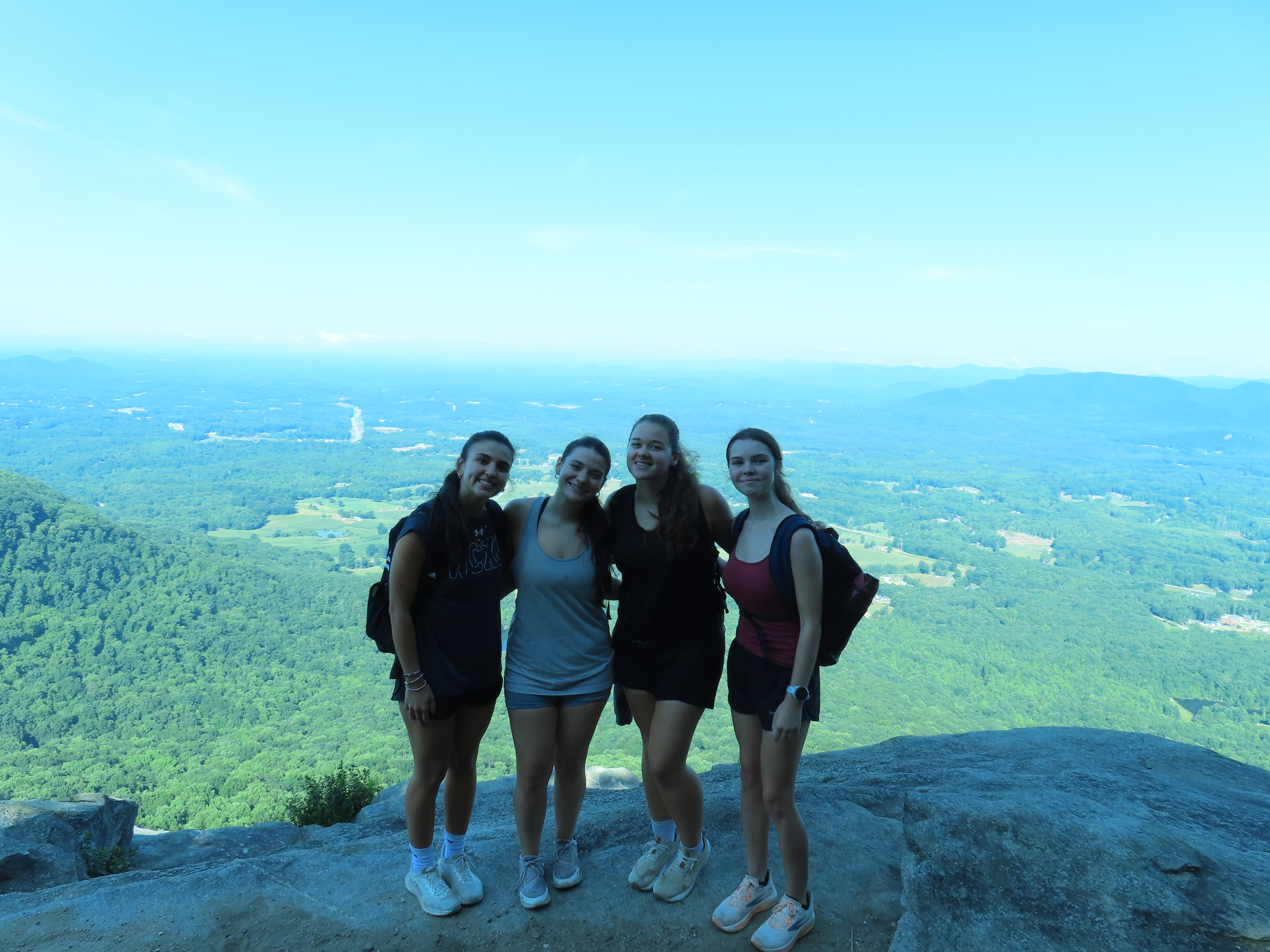 Woman on mountain with friends