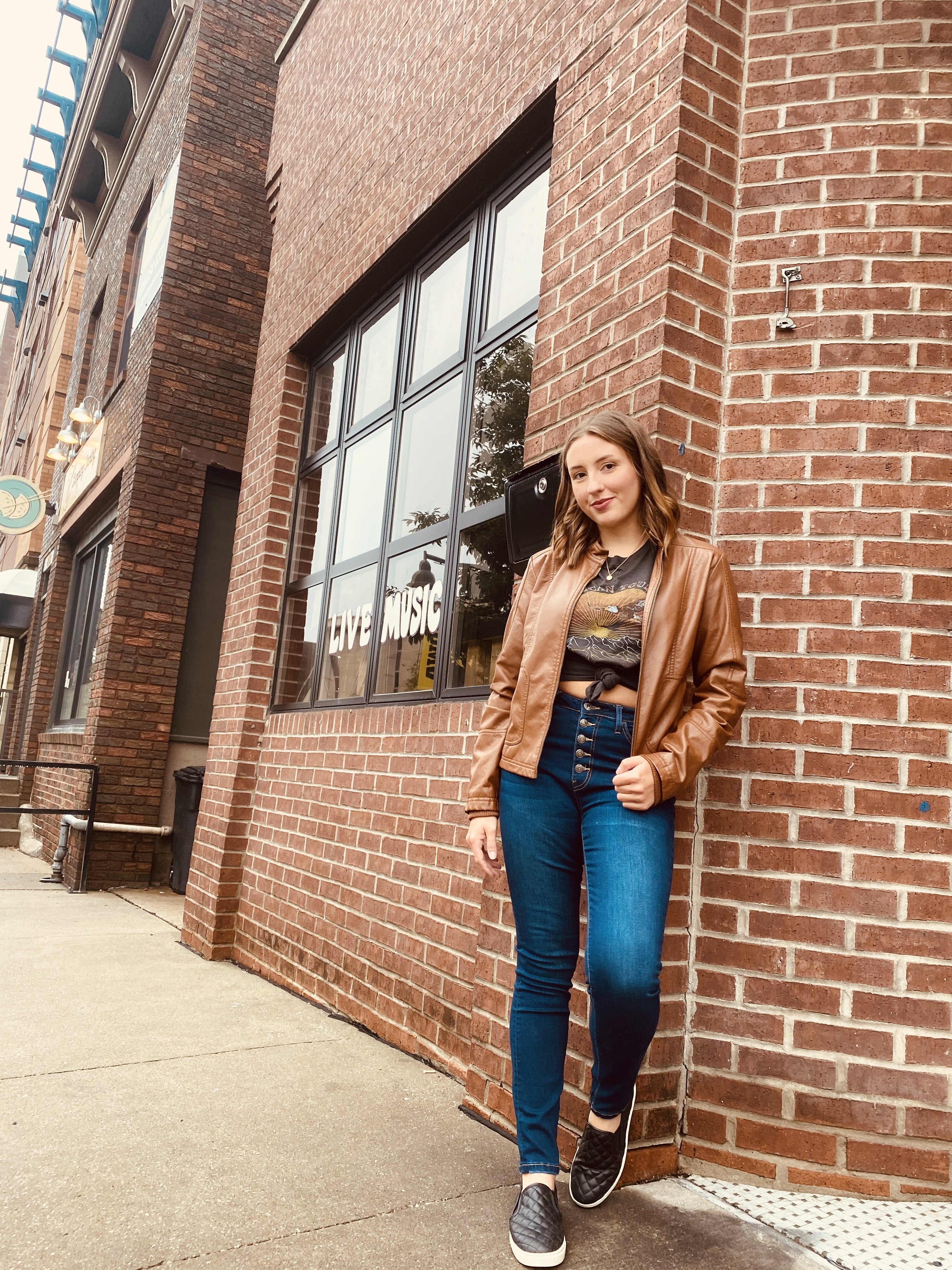 girl by live music window