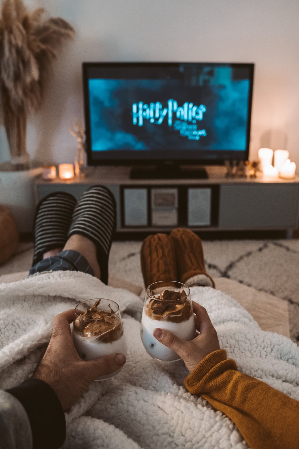 Two people watching a movie in slippers