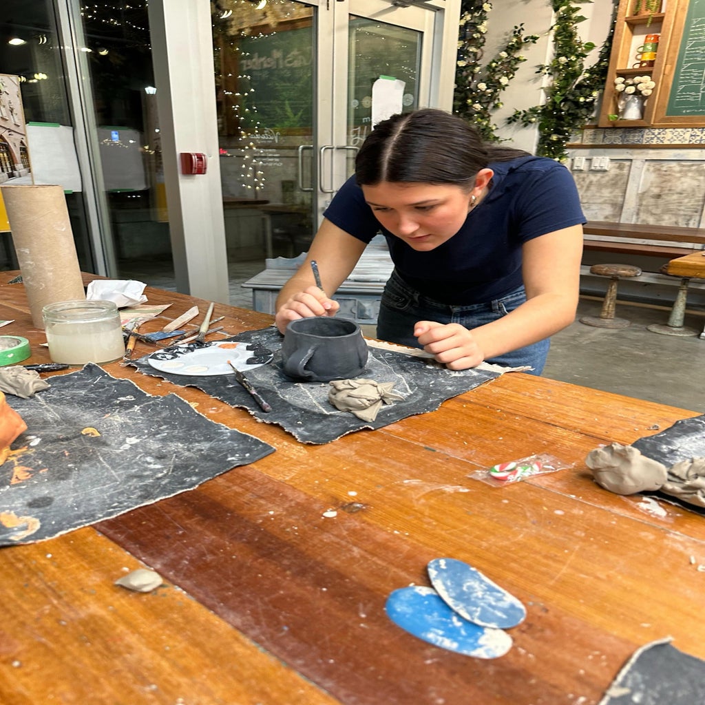 hc uvic members making clay in a pottery studio