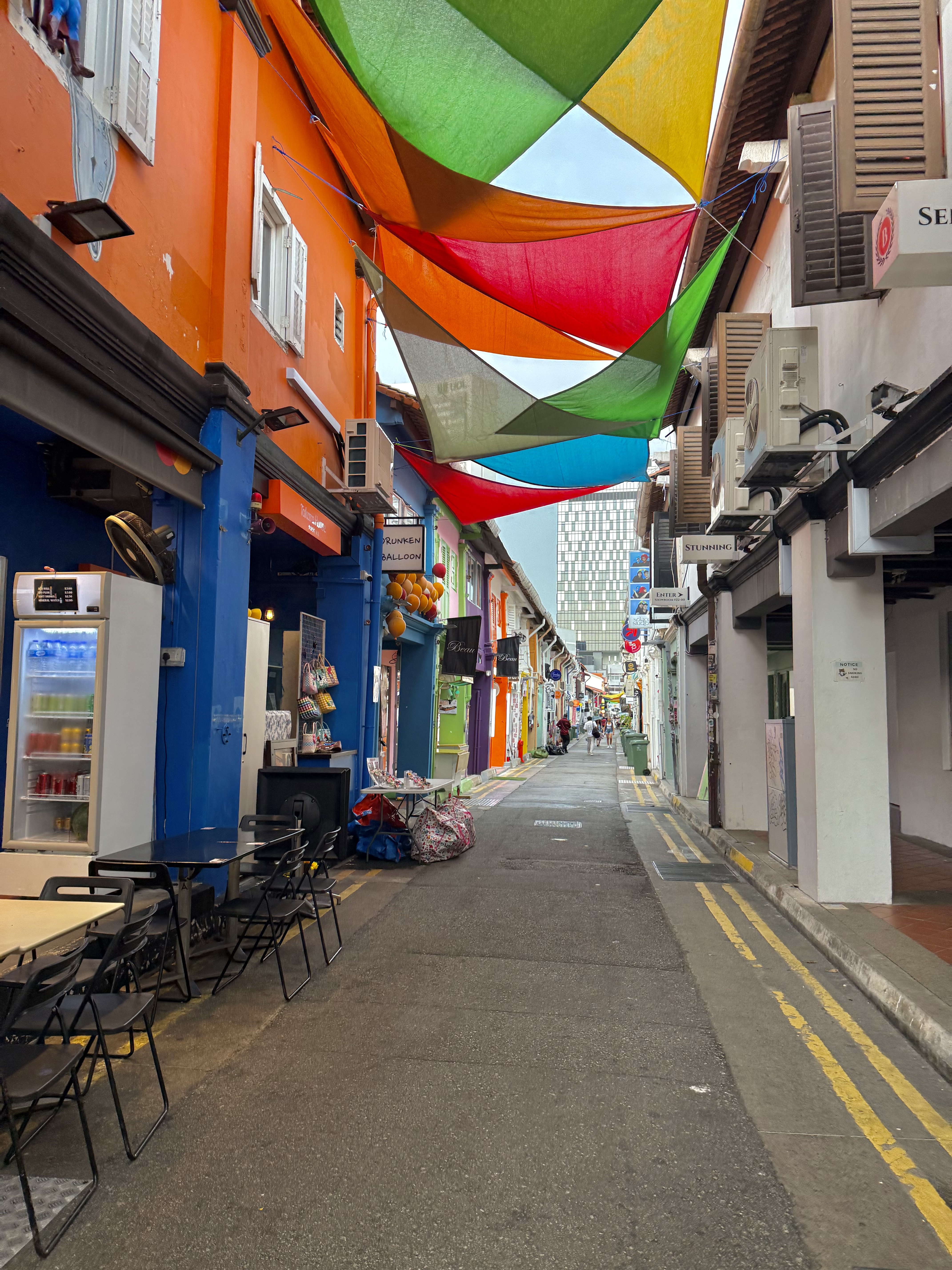Colorful fabric draped overhead a street