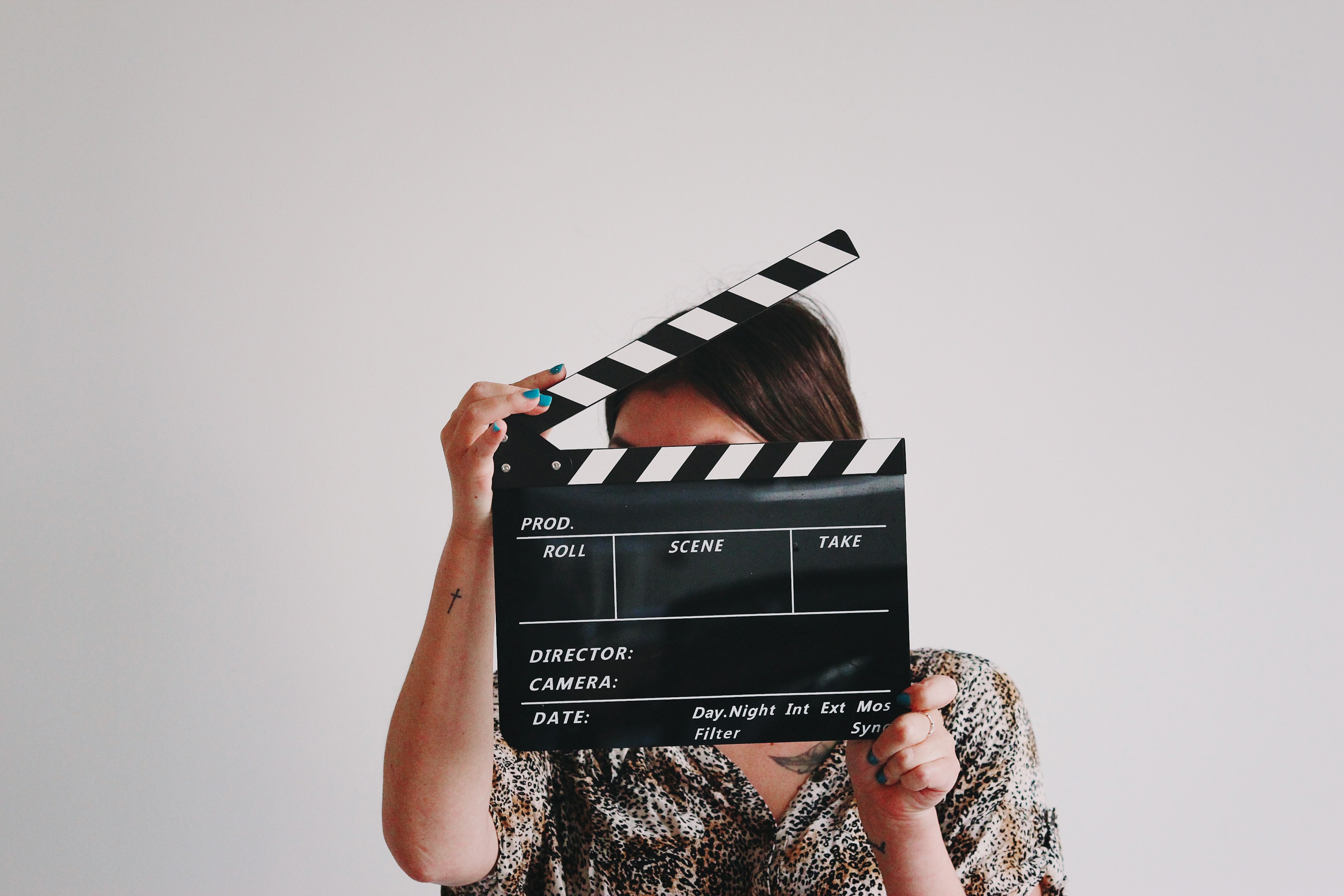 Women holding clapperboard