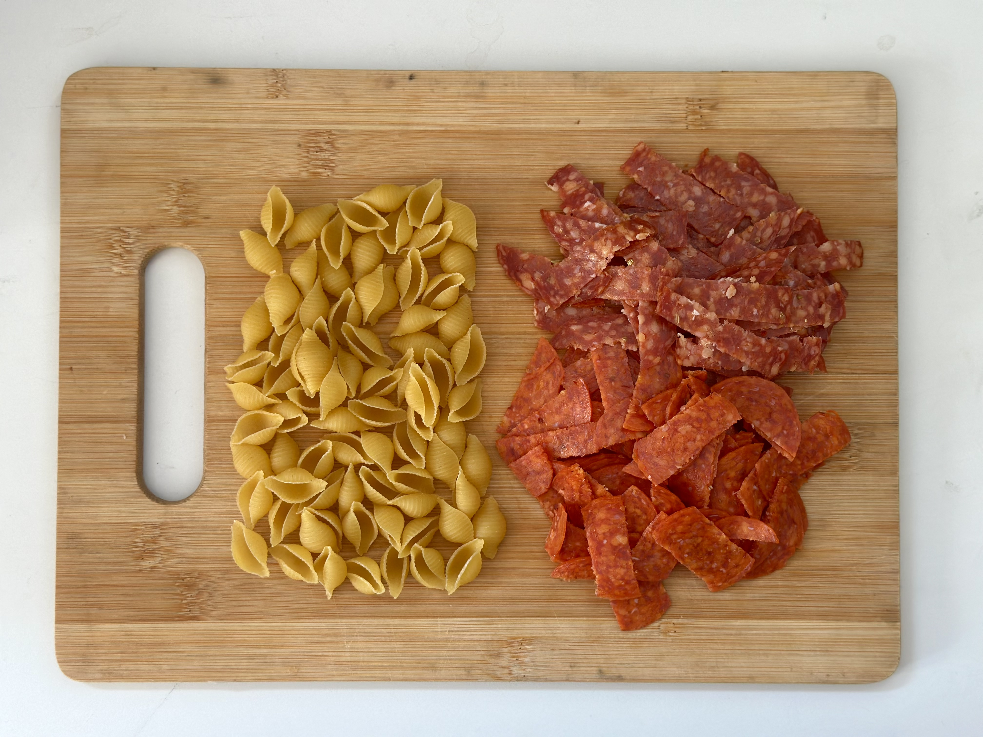 raw pasta and pepperoni
