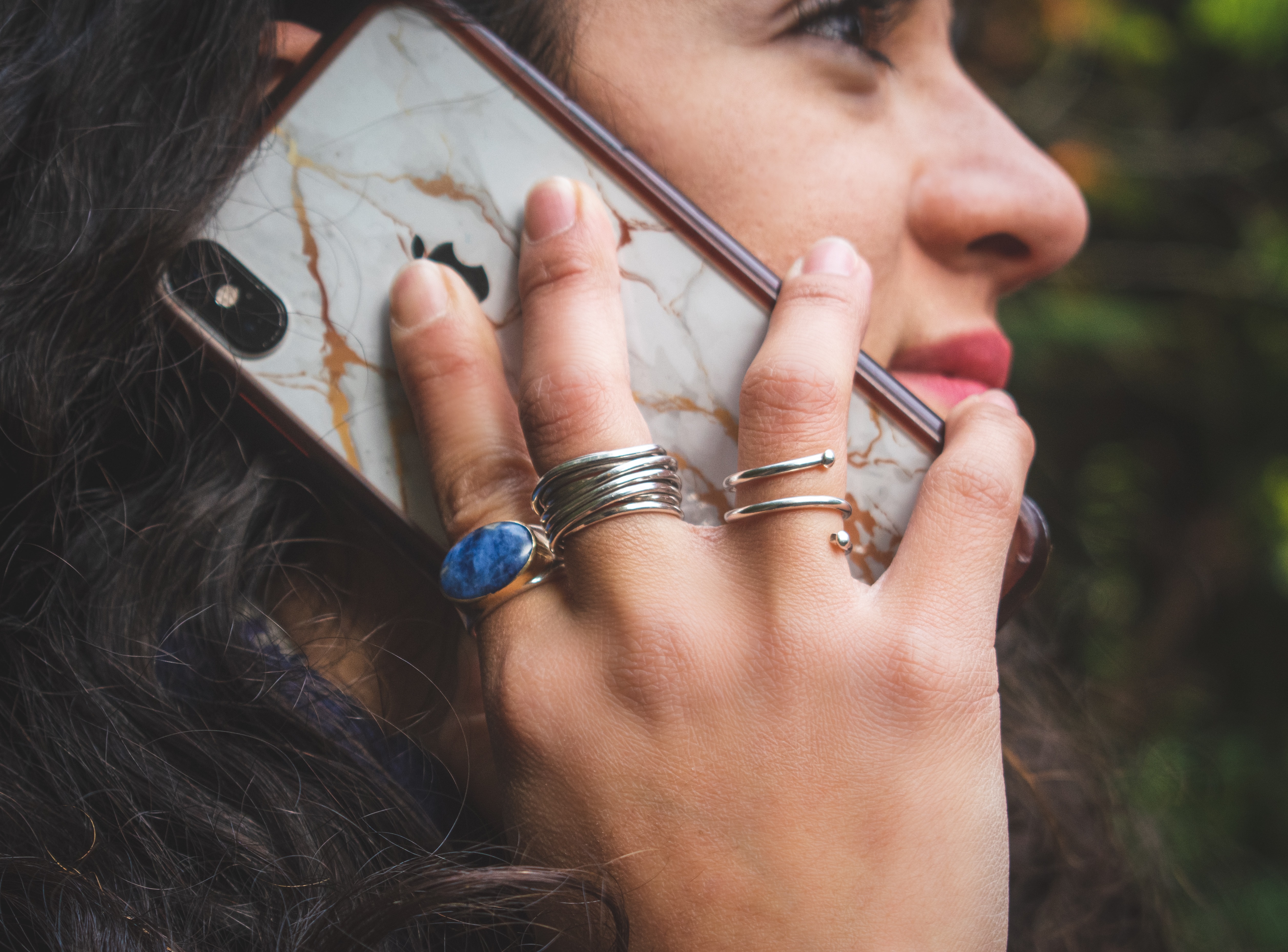 Woman holding an iPhone to her ear by Patricia Zavala?width=698&height=466&fit=crop&auto=webp&dpr=4