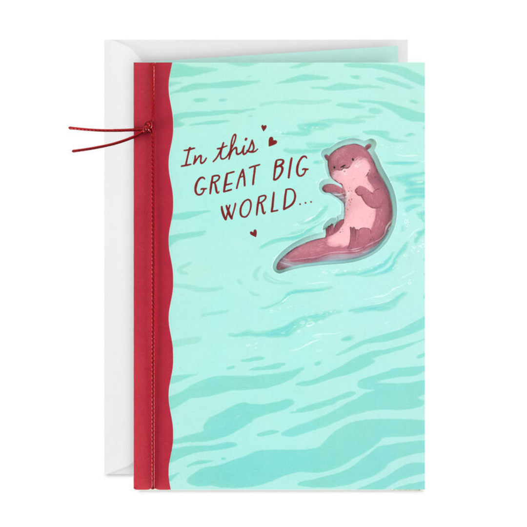 Greeting card with an illustrated otter floating on water against a teal background. Text reads, \