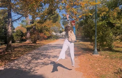 me jumping to catch a leaf at a wellness day event!