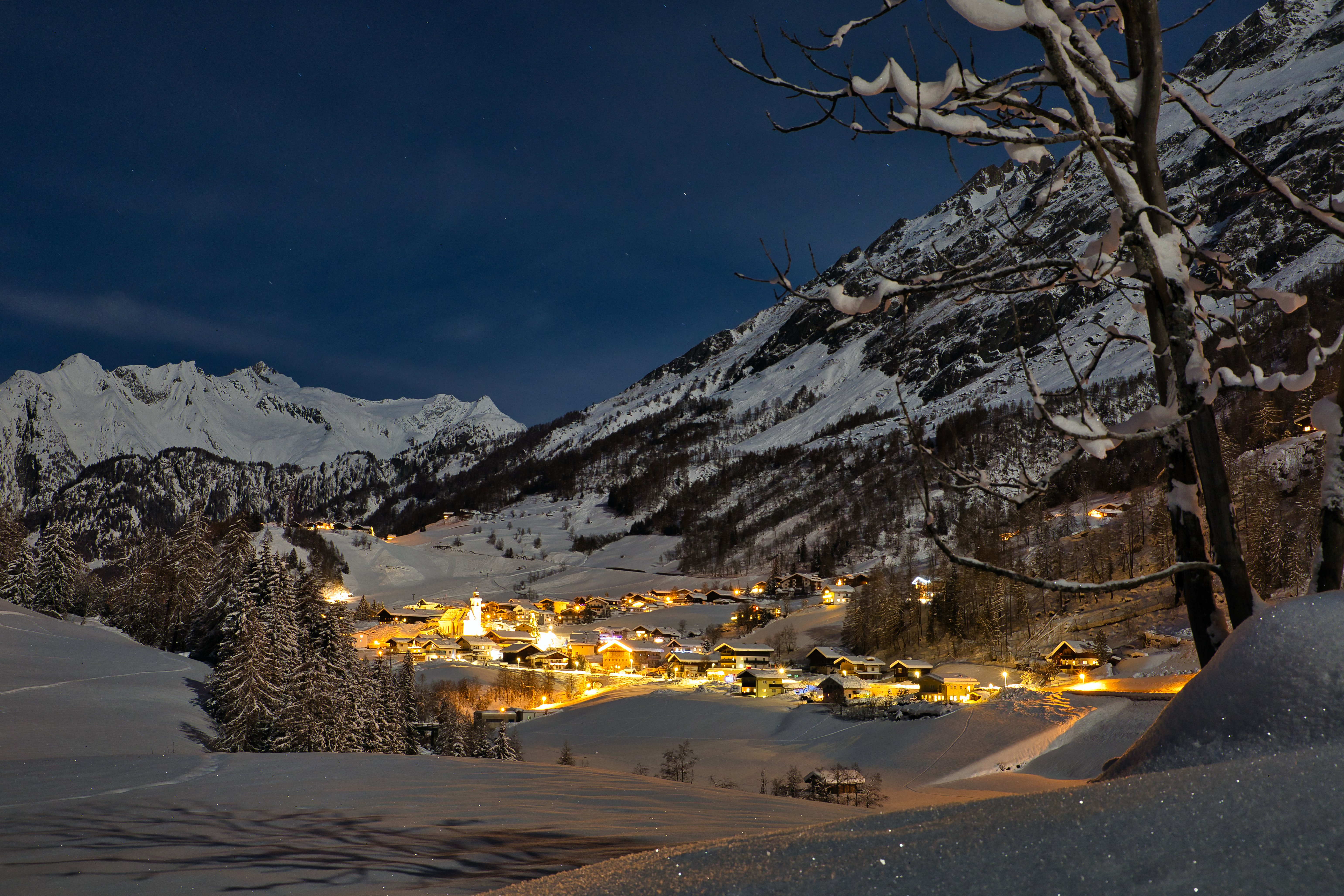 snow covered mountains during night time