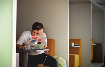 Man Studying in Coffee Shop