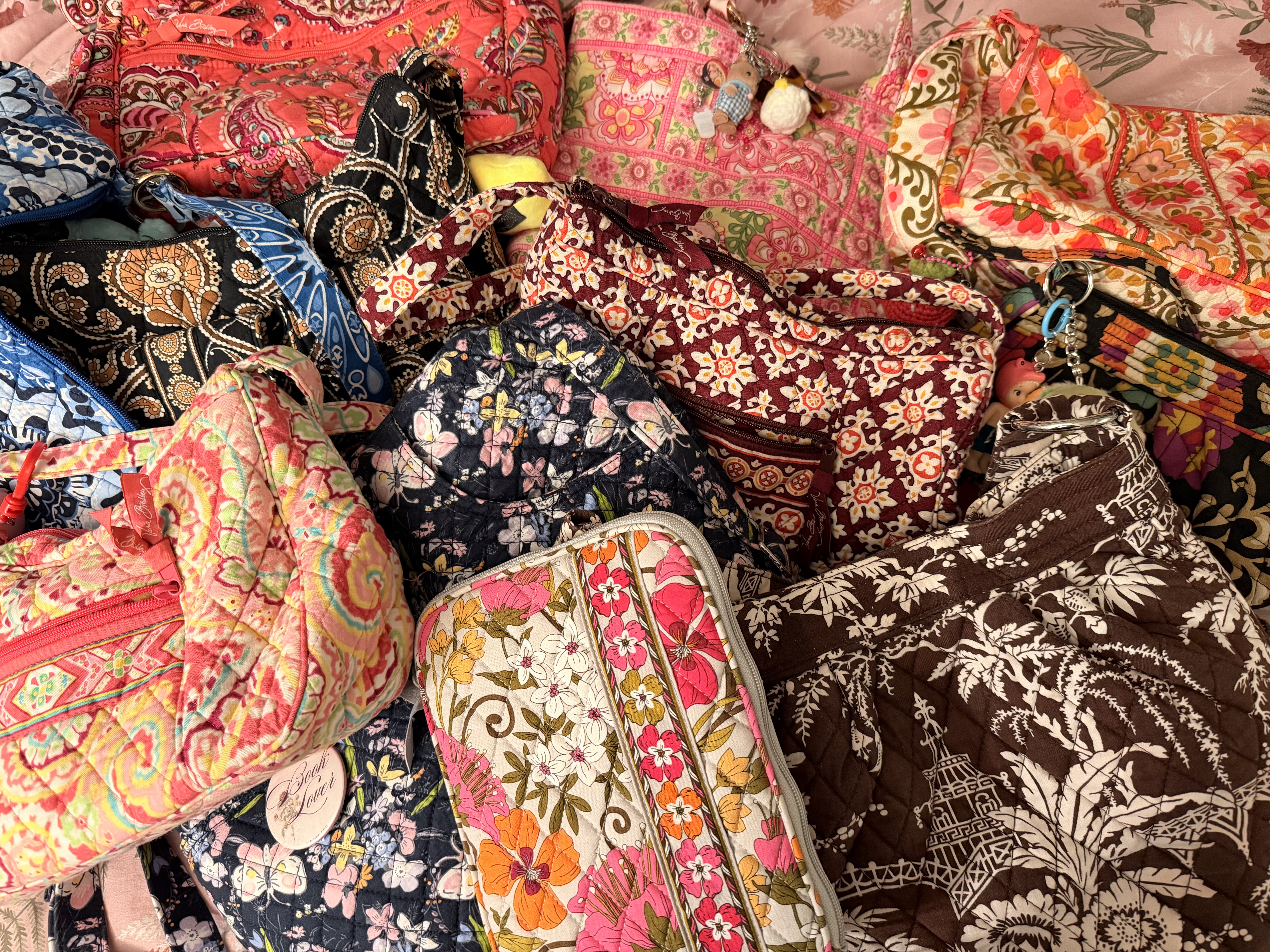 Various Vera Bradley bags together