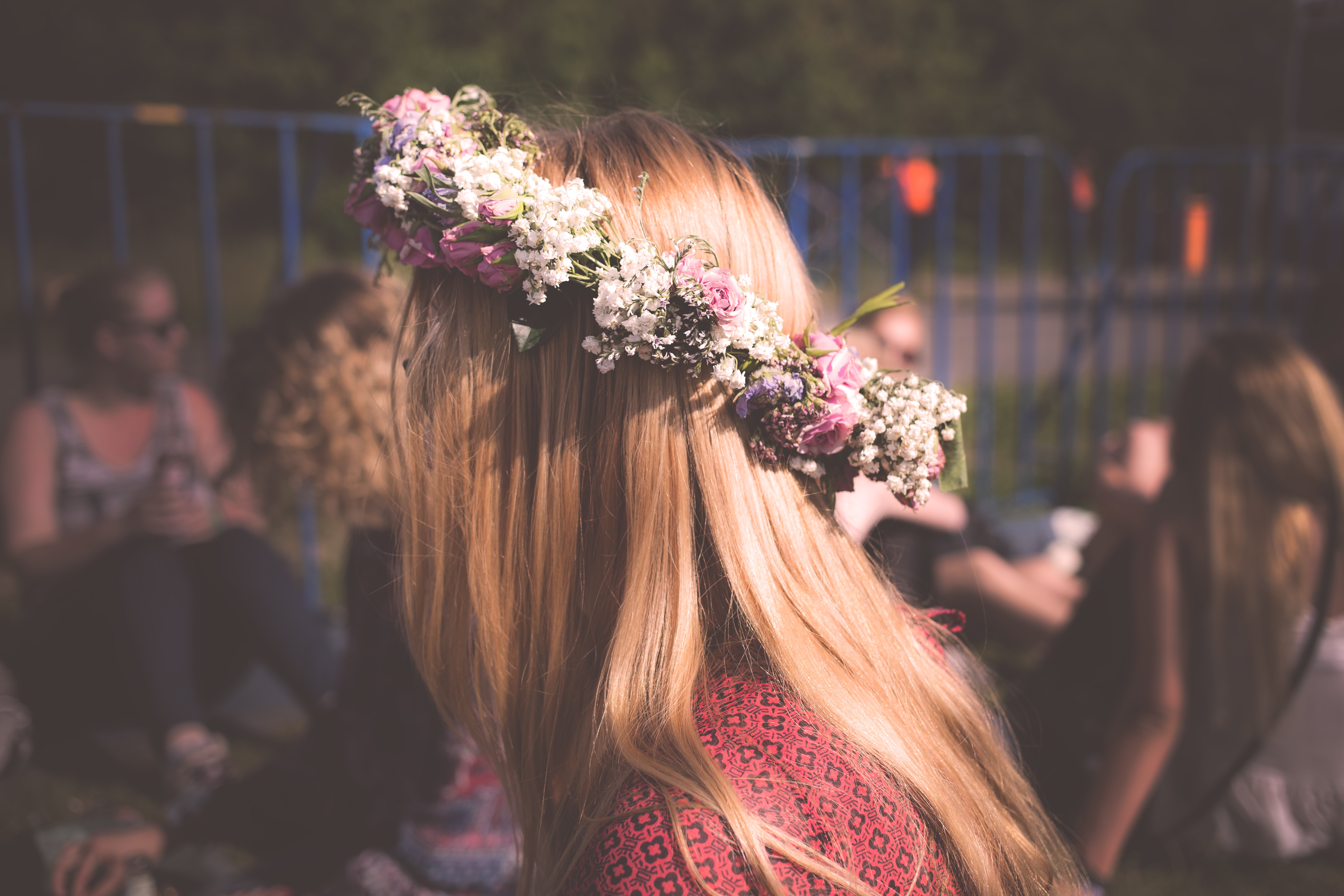 Woman with blonde hair and crown placed on their head.