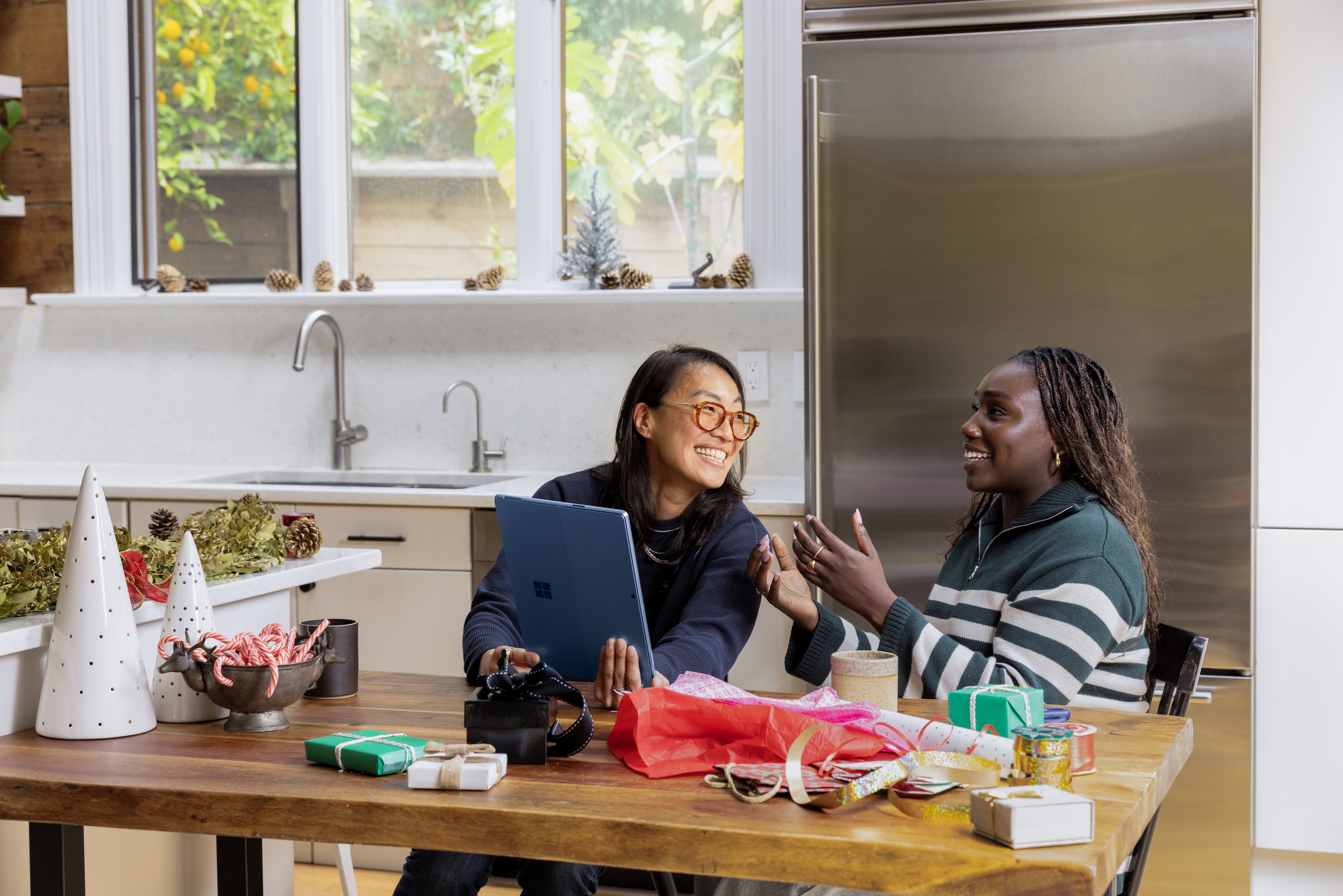 Girls chatting at kitchen table