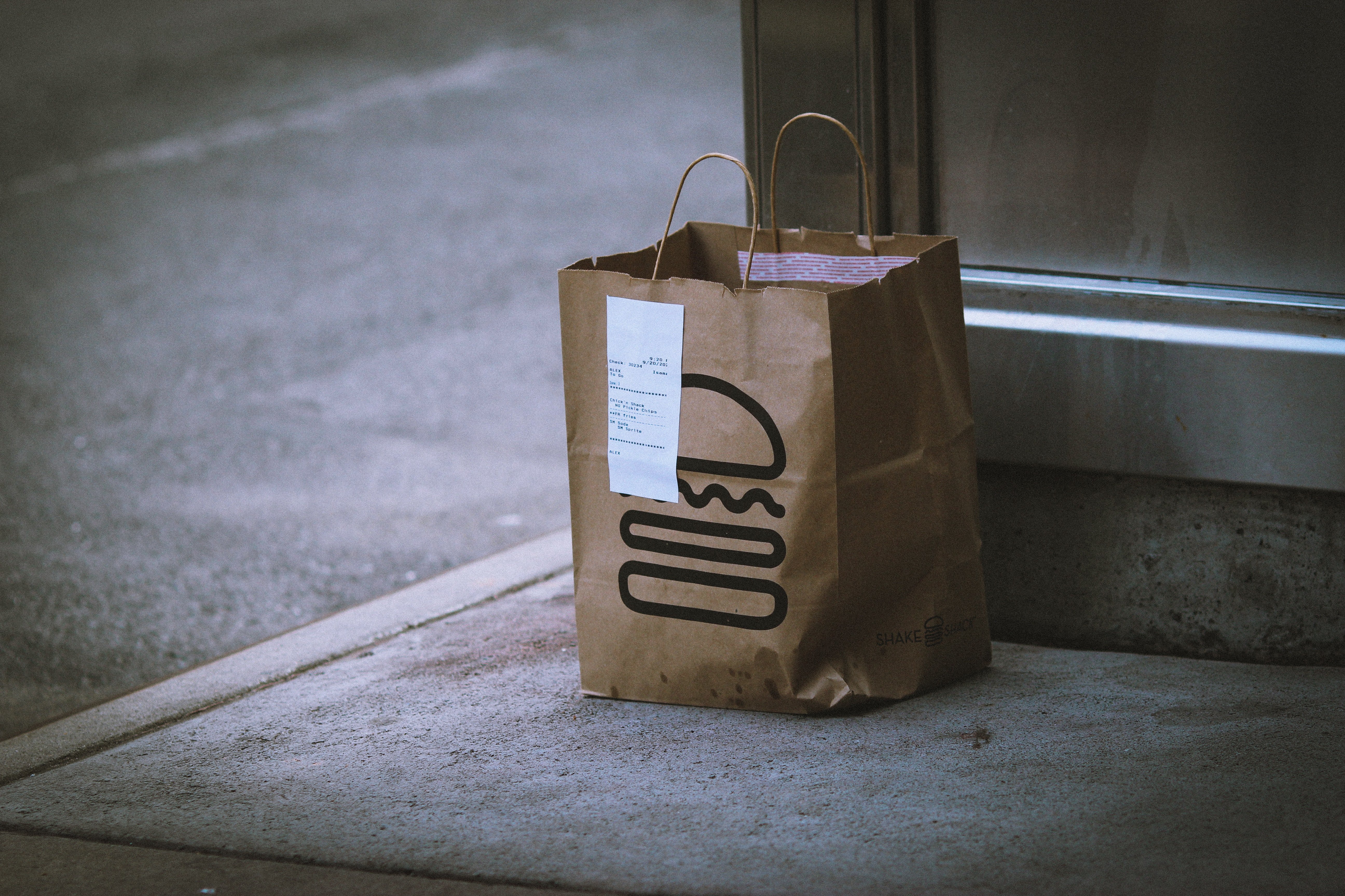 food delivery bag outside door by Jon Tyson via Unsplash?width=698&height=466&fit=crop&auto=webp&dpr=4