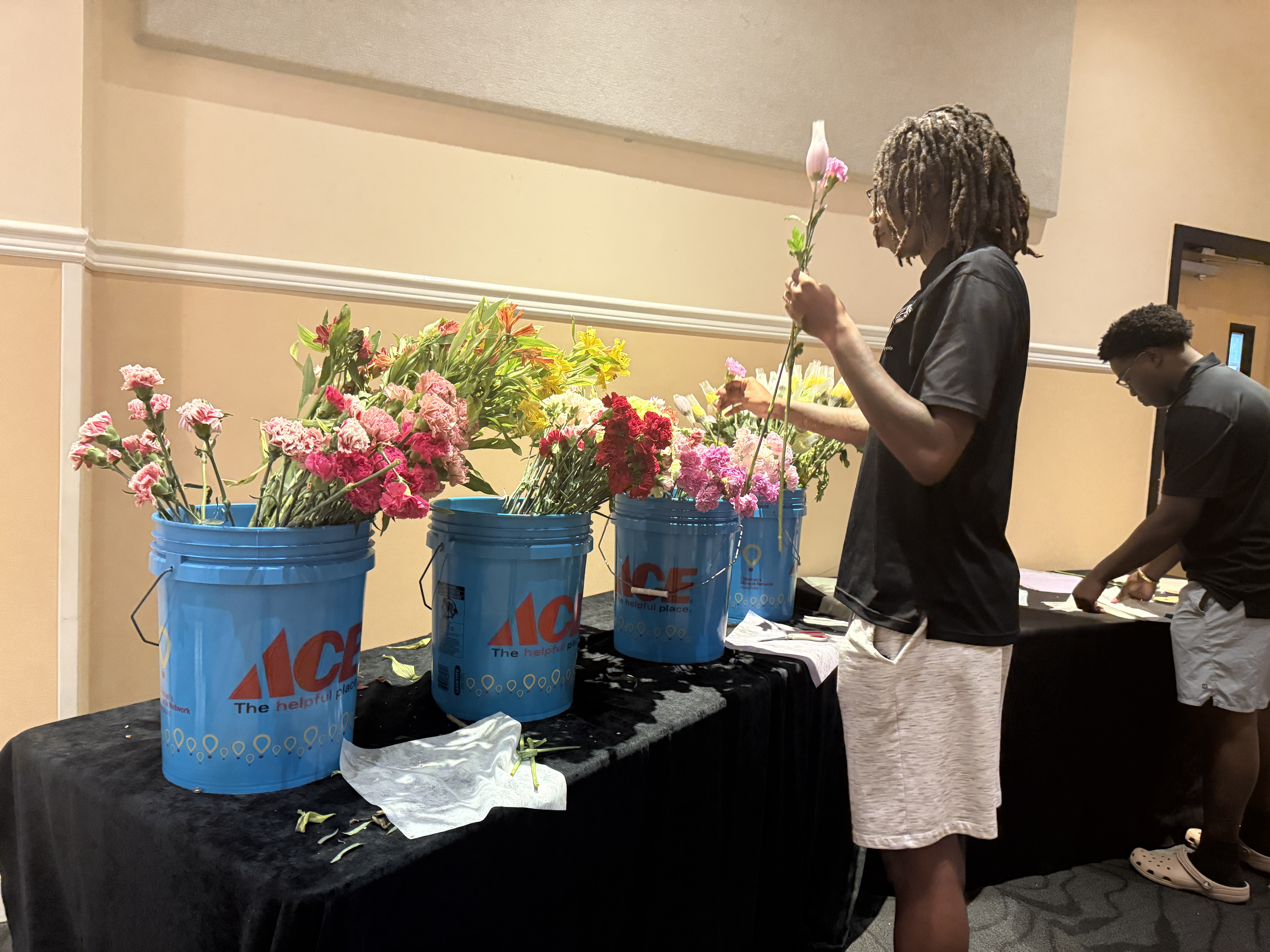 Students making their own flower bouquets.