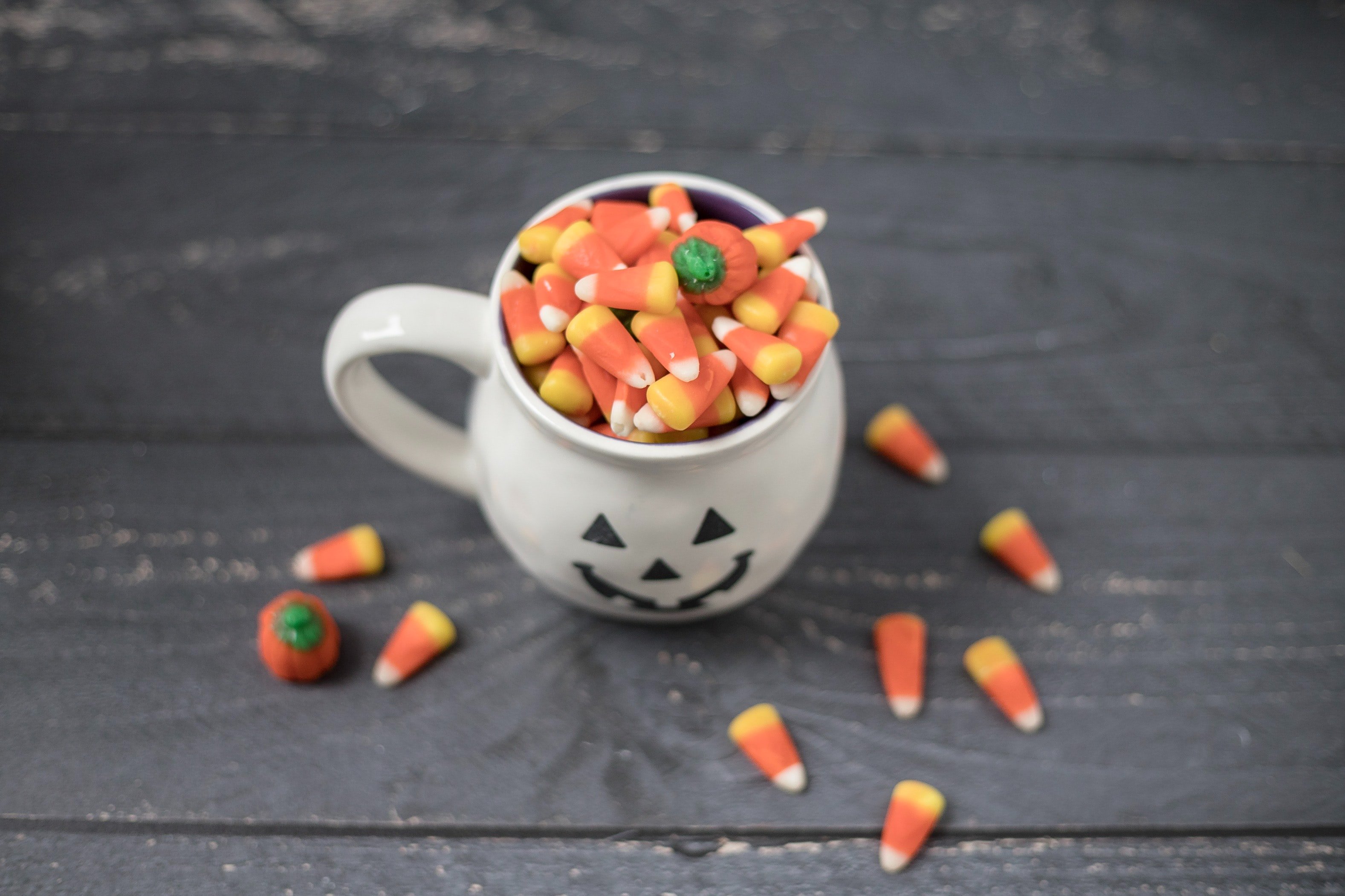 Halloween jack-o-lantern mug filled with candy corn