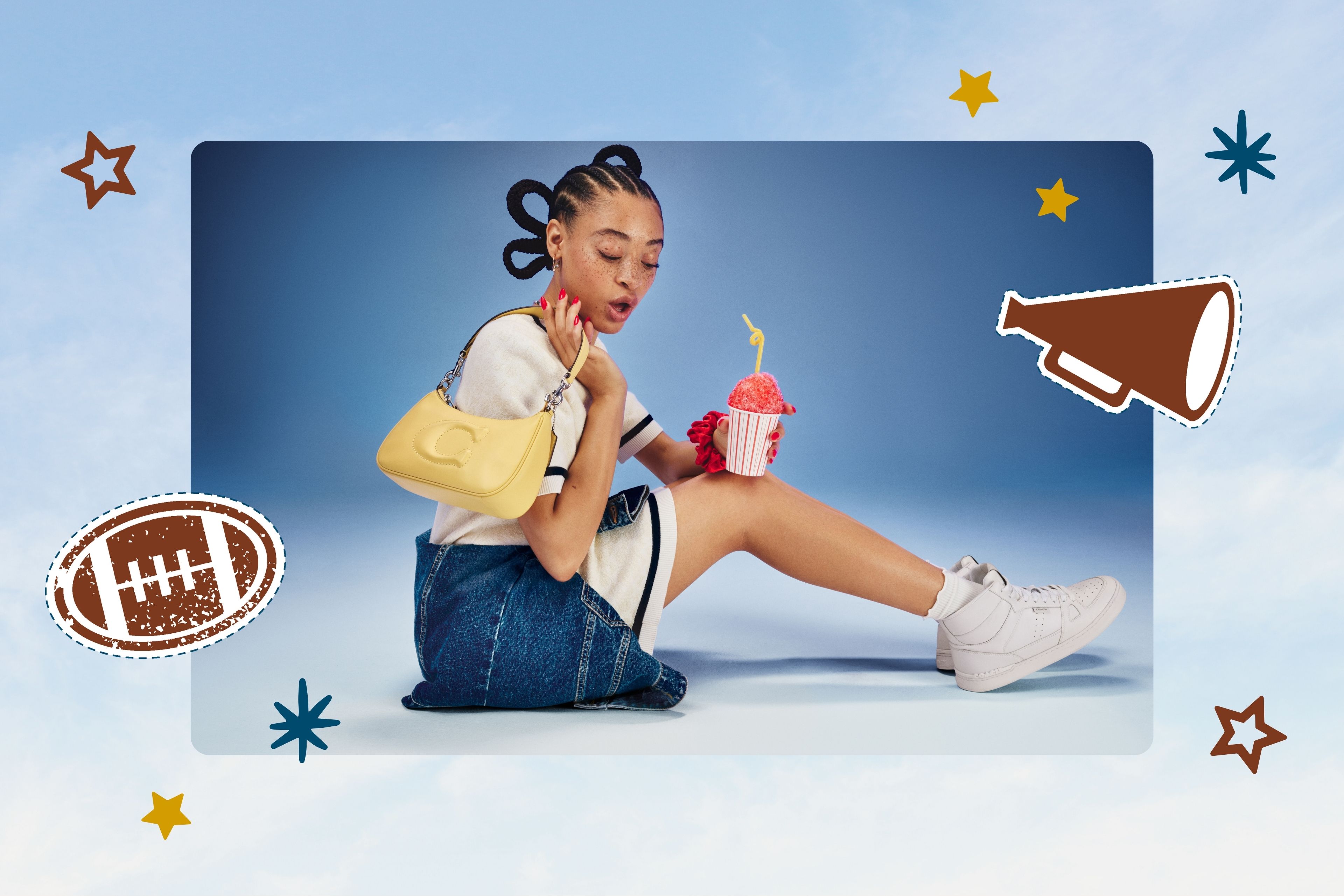 woman sitting on the ground holding a yellow purse and a slushie