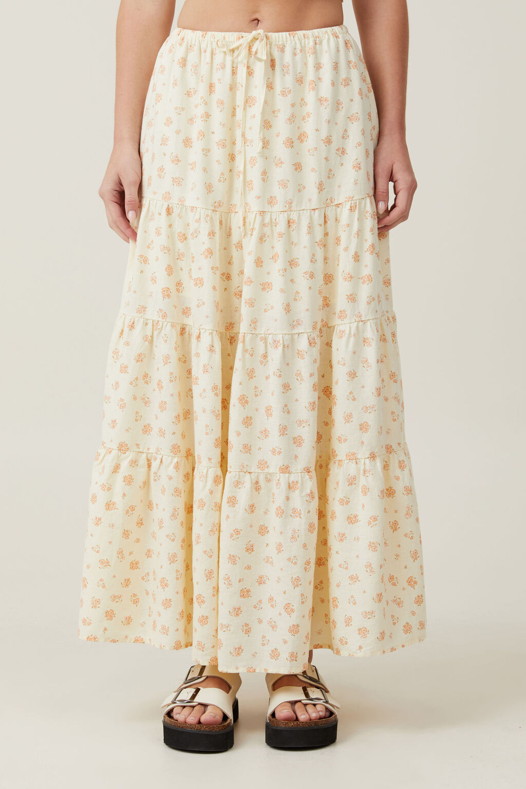 light yellow tiered maxi skirt with floral pattern