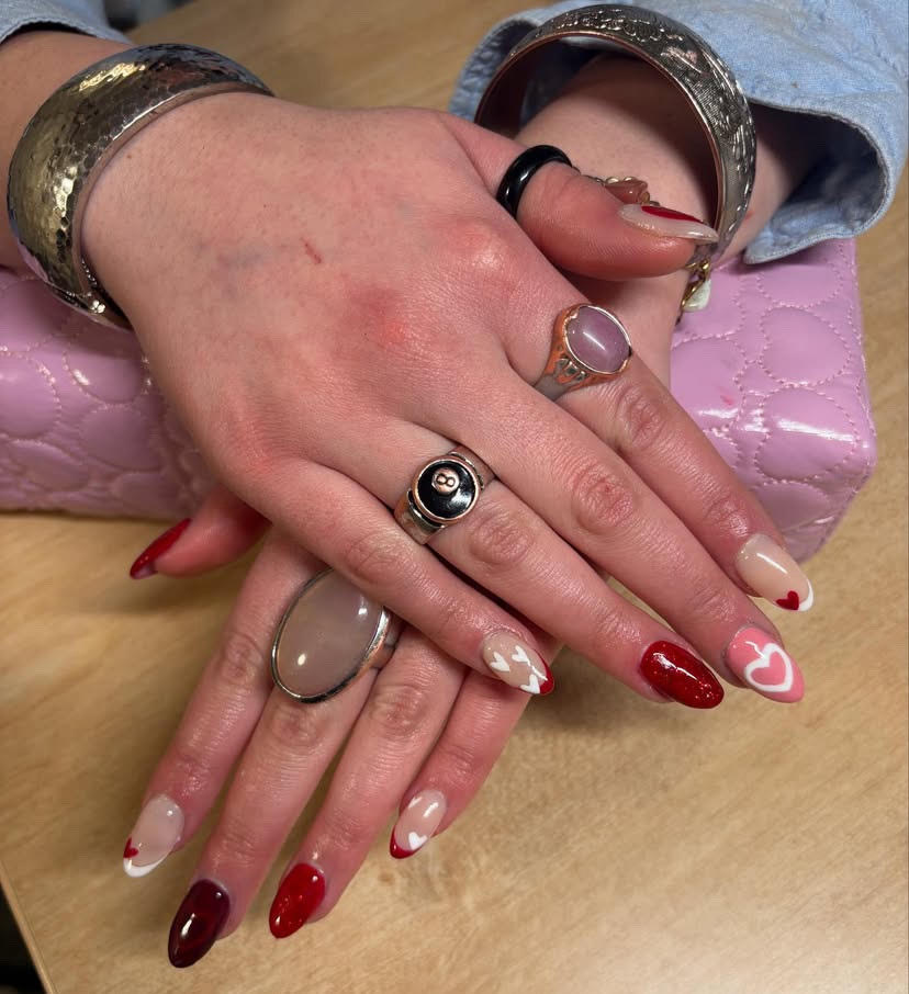 fancy coloured nails on white hands