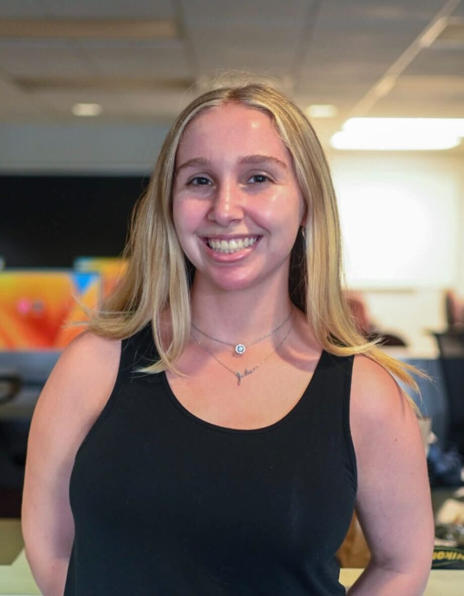 julia merola (the writer) with her nameplate necklace