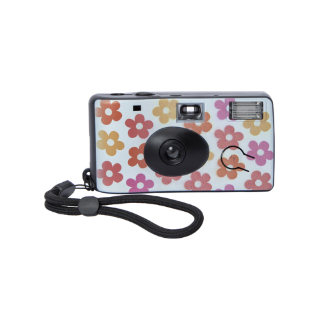 disposable camera with white, pink, orange, and yellow floral pattern and black wrist strap