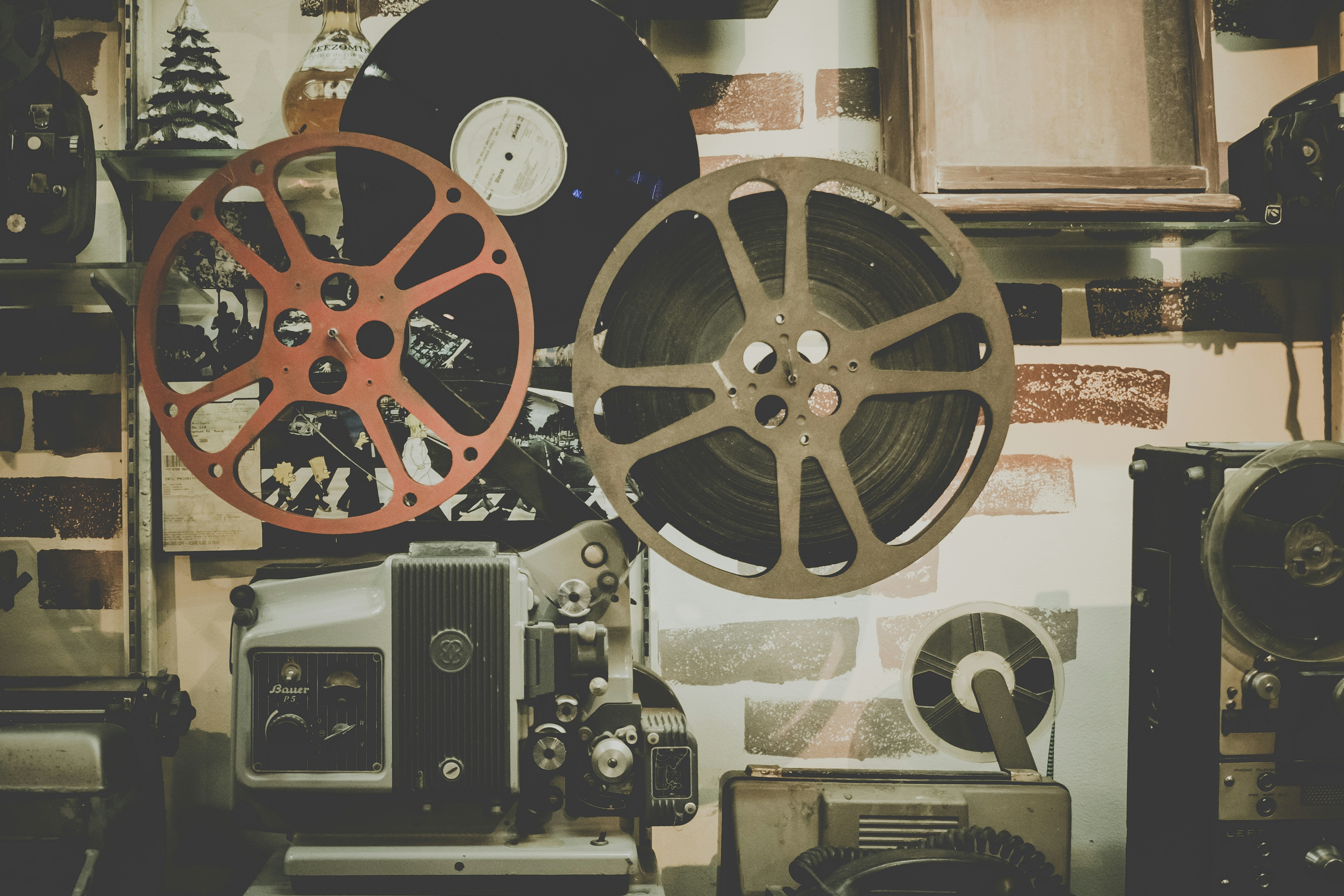 Camera and reels of film on background