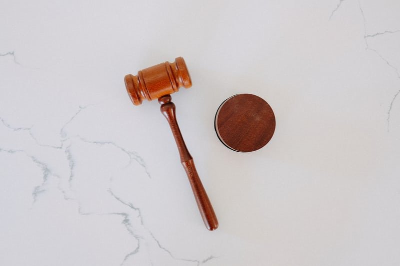Gavel on white marble