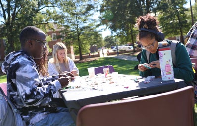 Students making fidget spinners at the Self-Care Fair on McKeldin