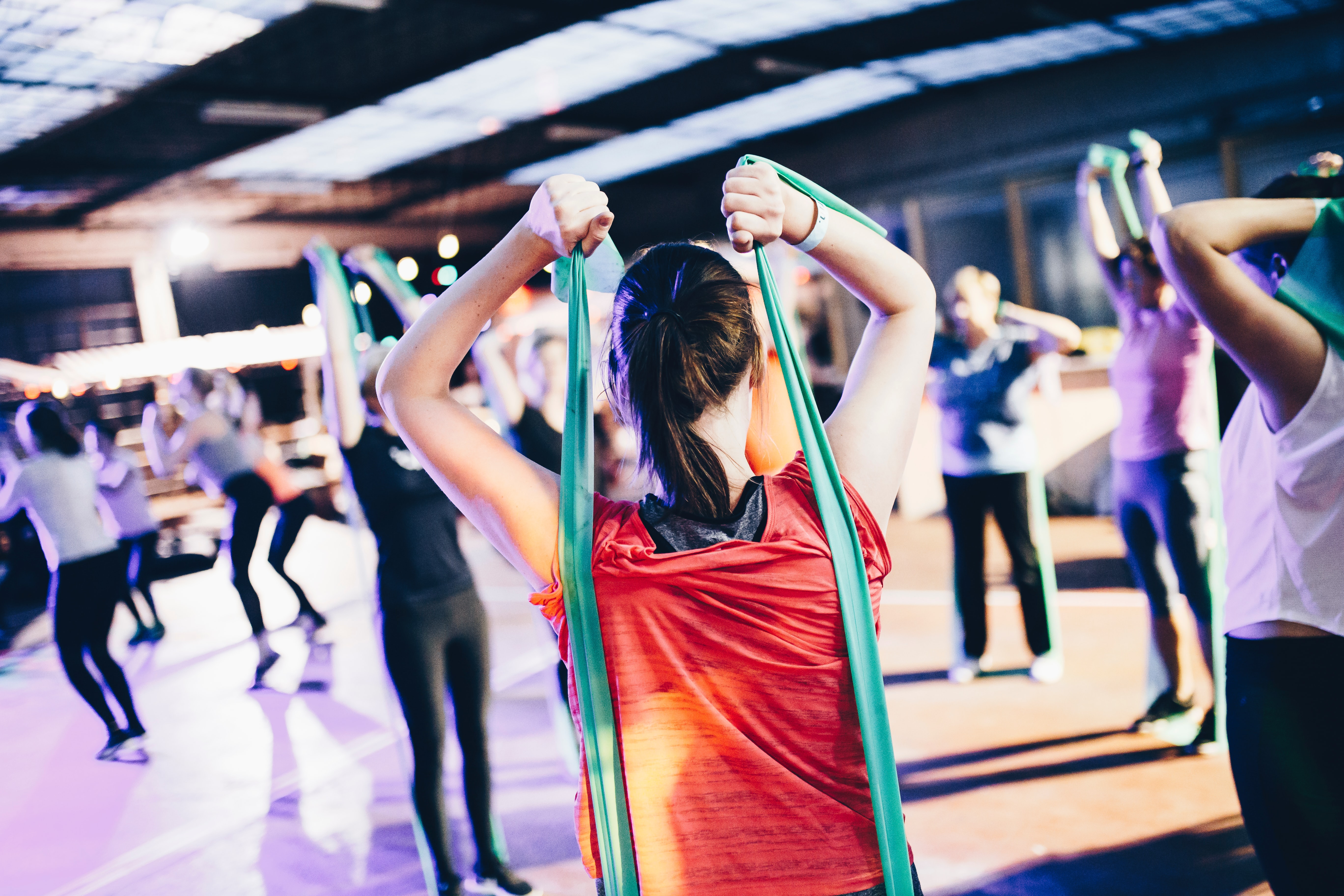 woman in workout class by Geert Pieters via Unsplash