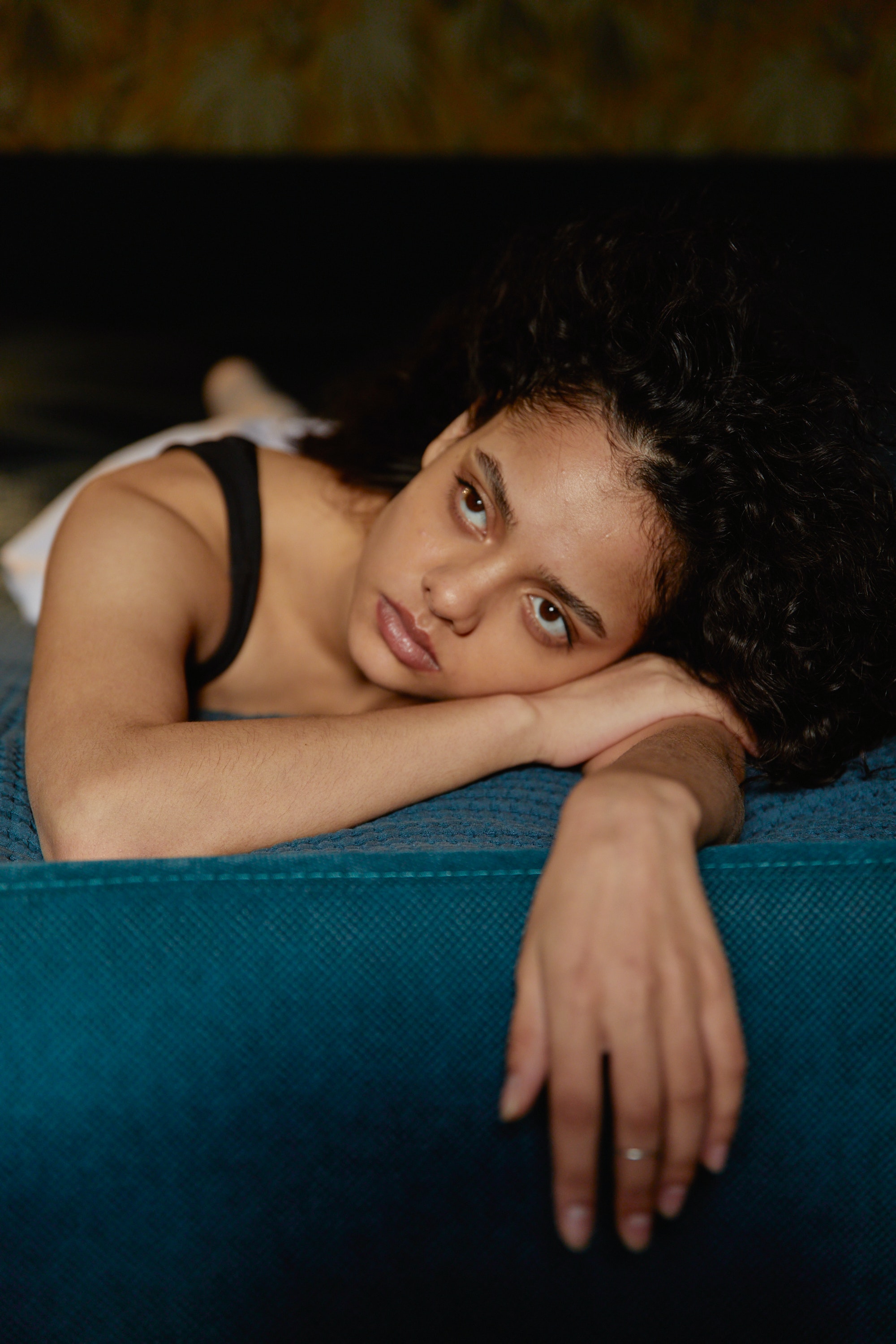 woman lying in bed looking up