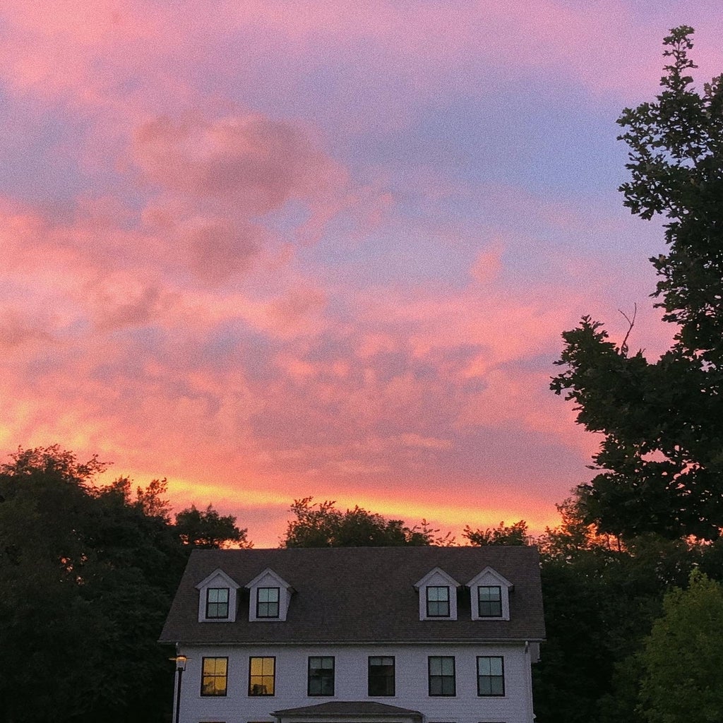 sunset over house
