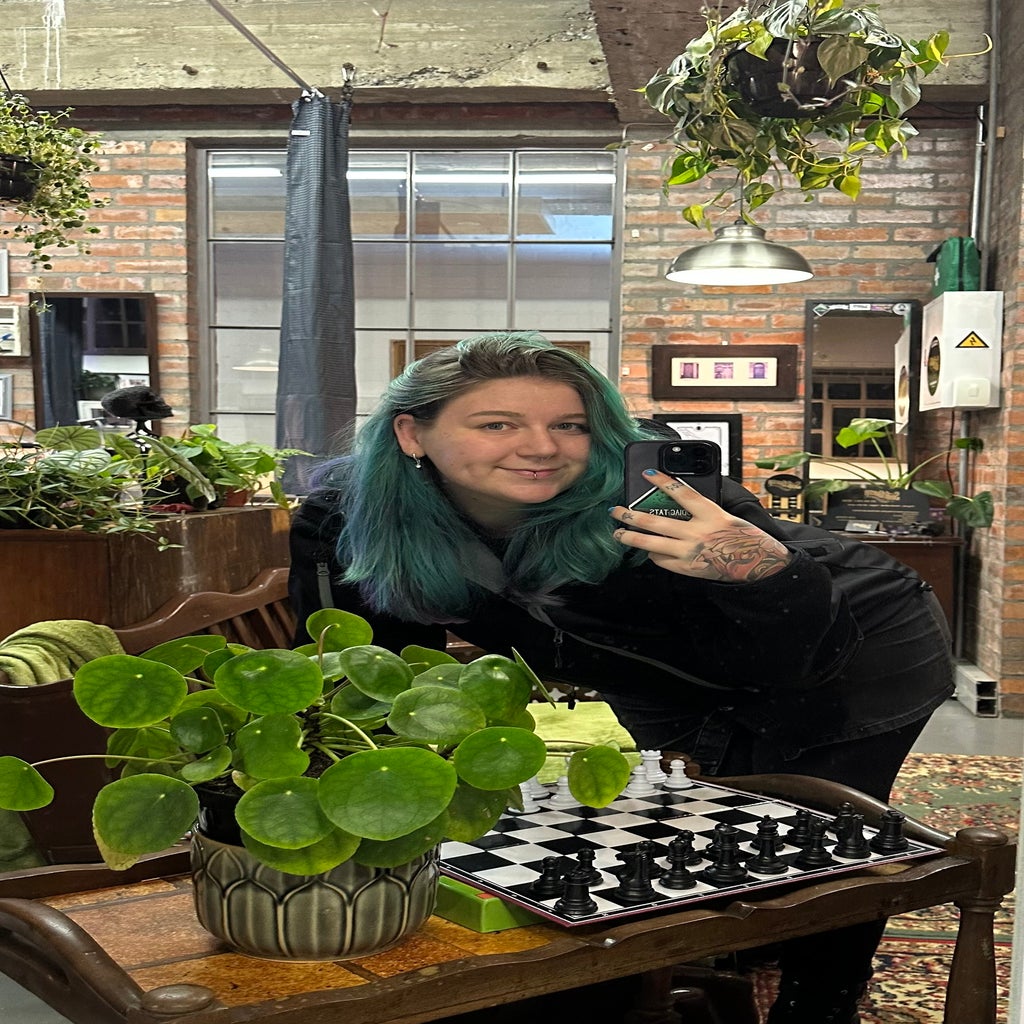 Woman taking a photo of herself in the mirror