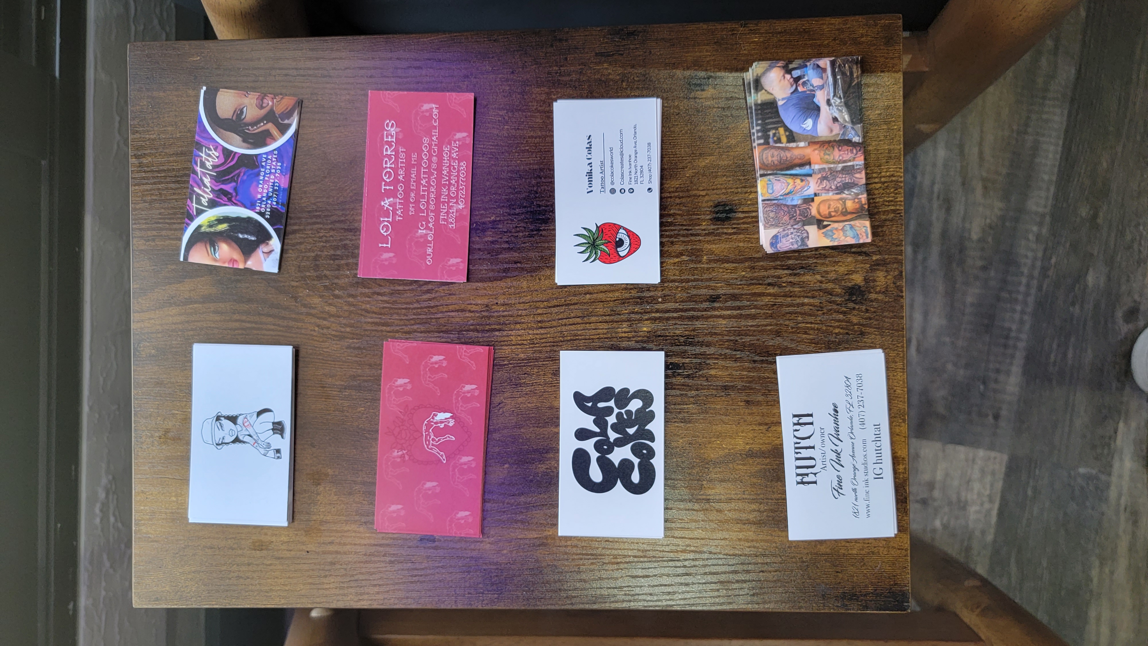 Business cards of all the artists mentioned