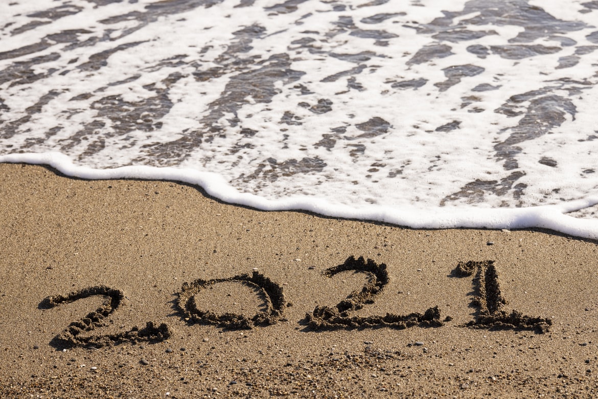 Beach with \"2021\" written in the sand