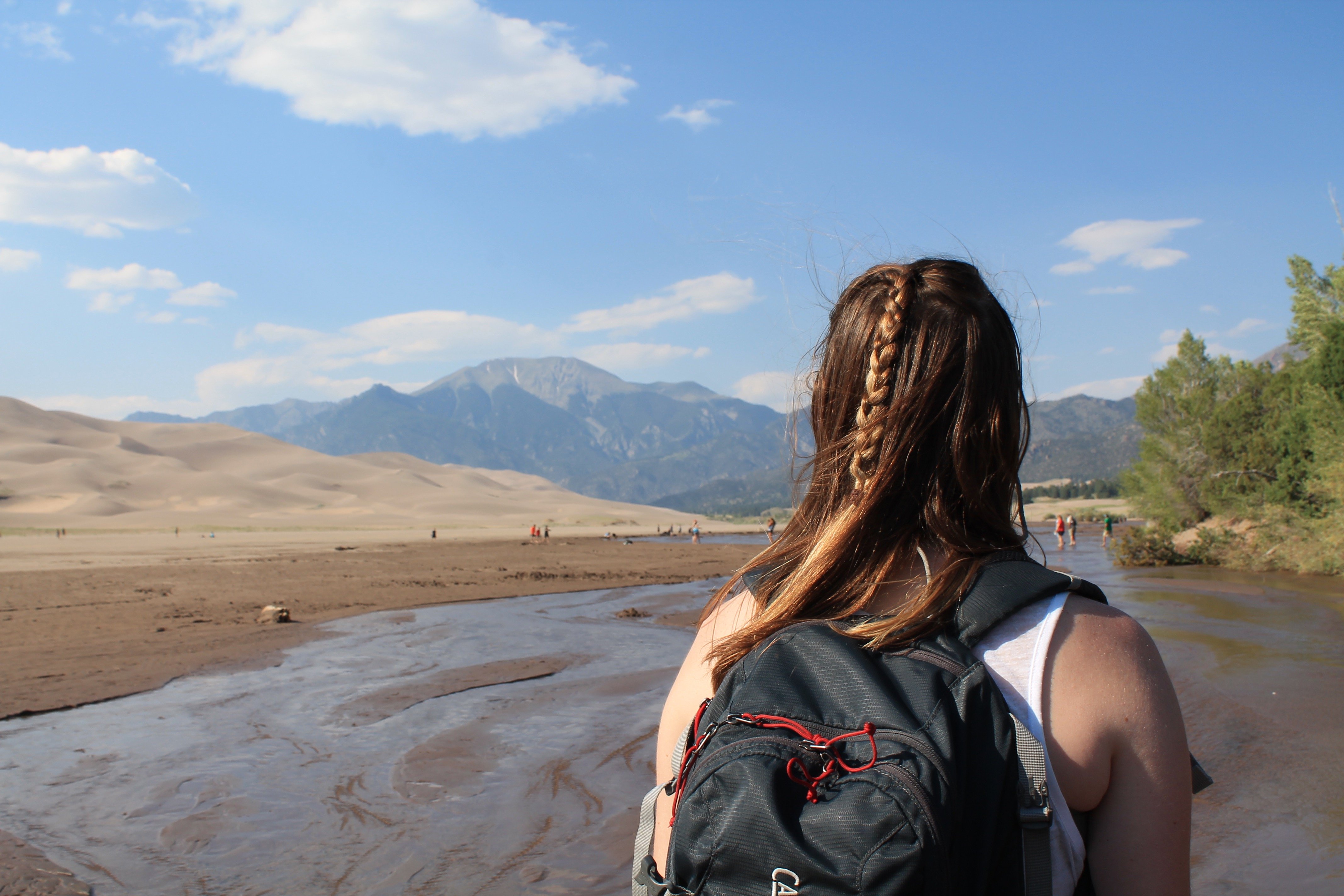 girl mountains sand summer adventure roadtrip braid backpack creek
