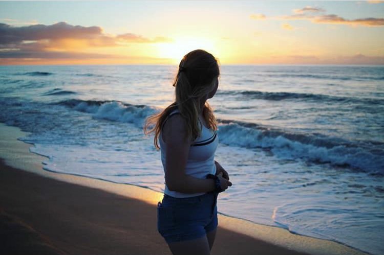 charlotte reader sunset beach girl ocean water sky nature peaceful?width=698&height=466&fit=crop&auto=webp&dpr=4