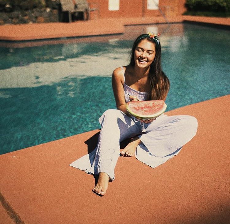 girl laughing watermelon pool summer