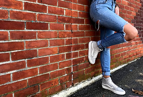 Meredith Kress brick wall ripped jeans leg up?width=698&height=466&fit=crop&auto=webp&dpr=4