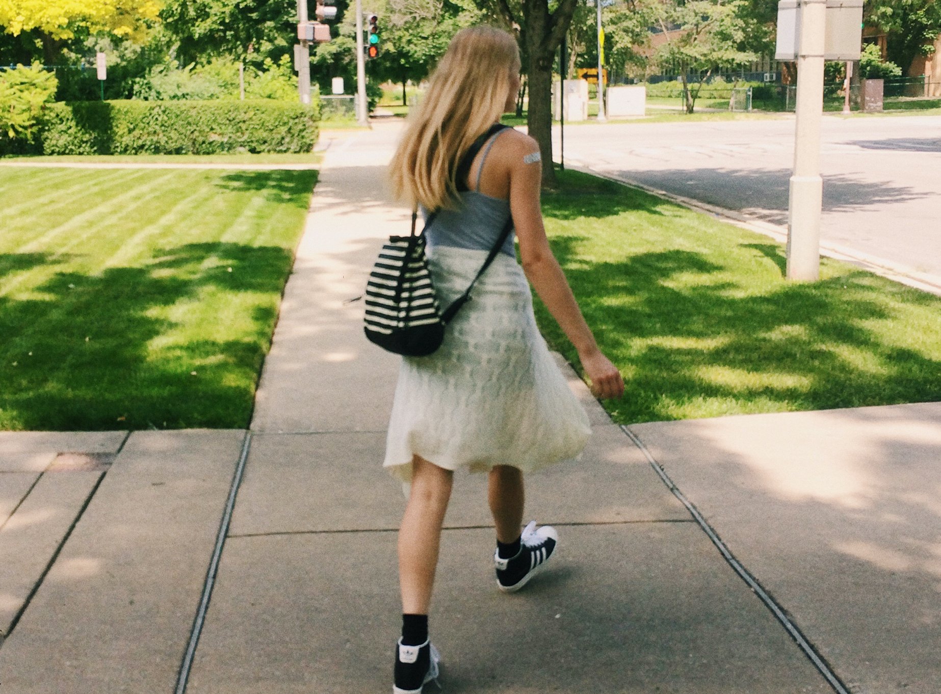 Anna Schultz girl walking with backpack?width=698&height=466&fit=crop&auto=webp&dpr=4