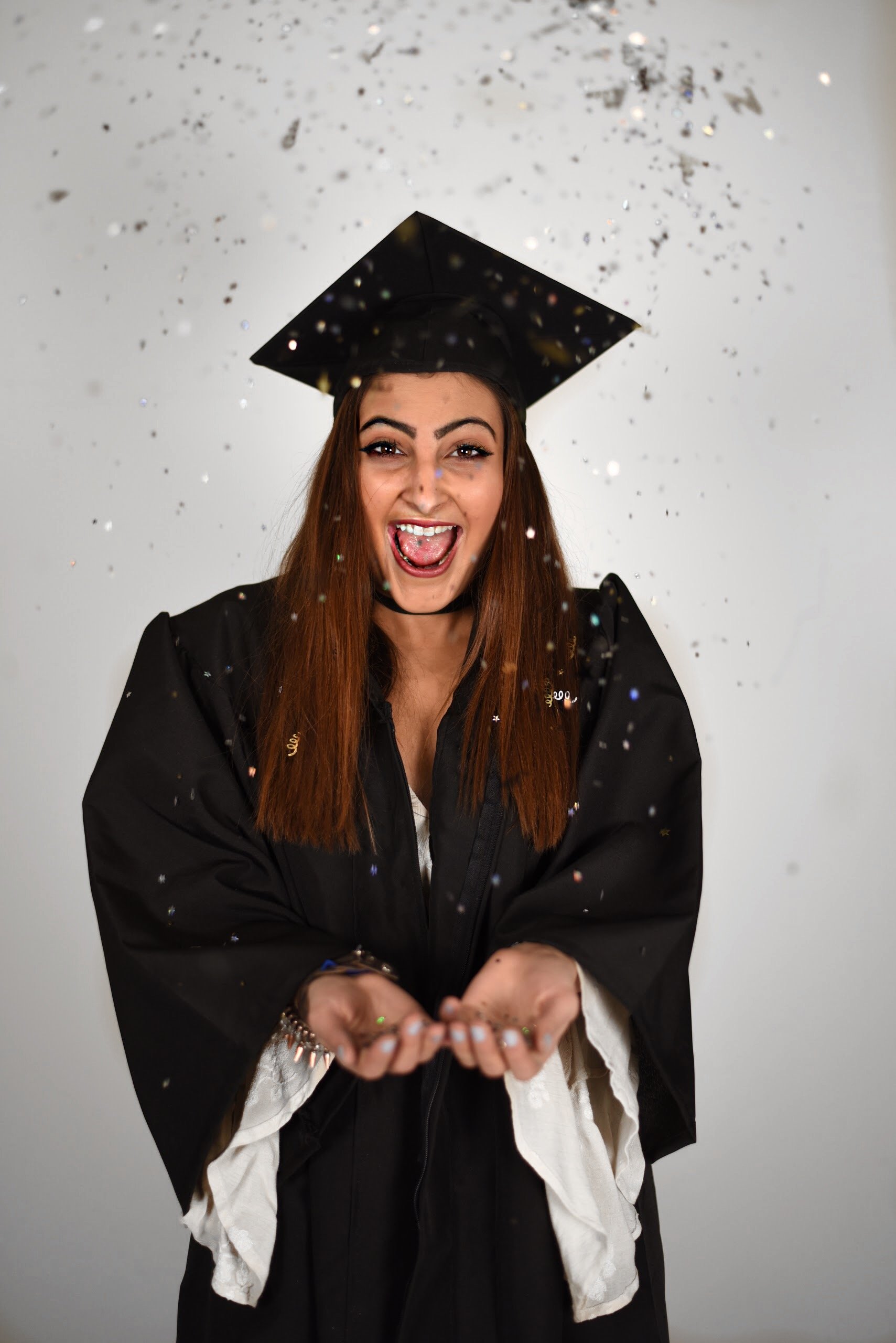 Graduate Celebrating With Confetti