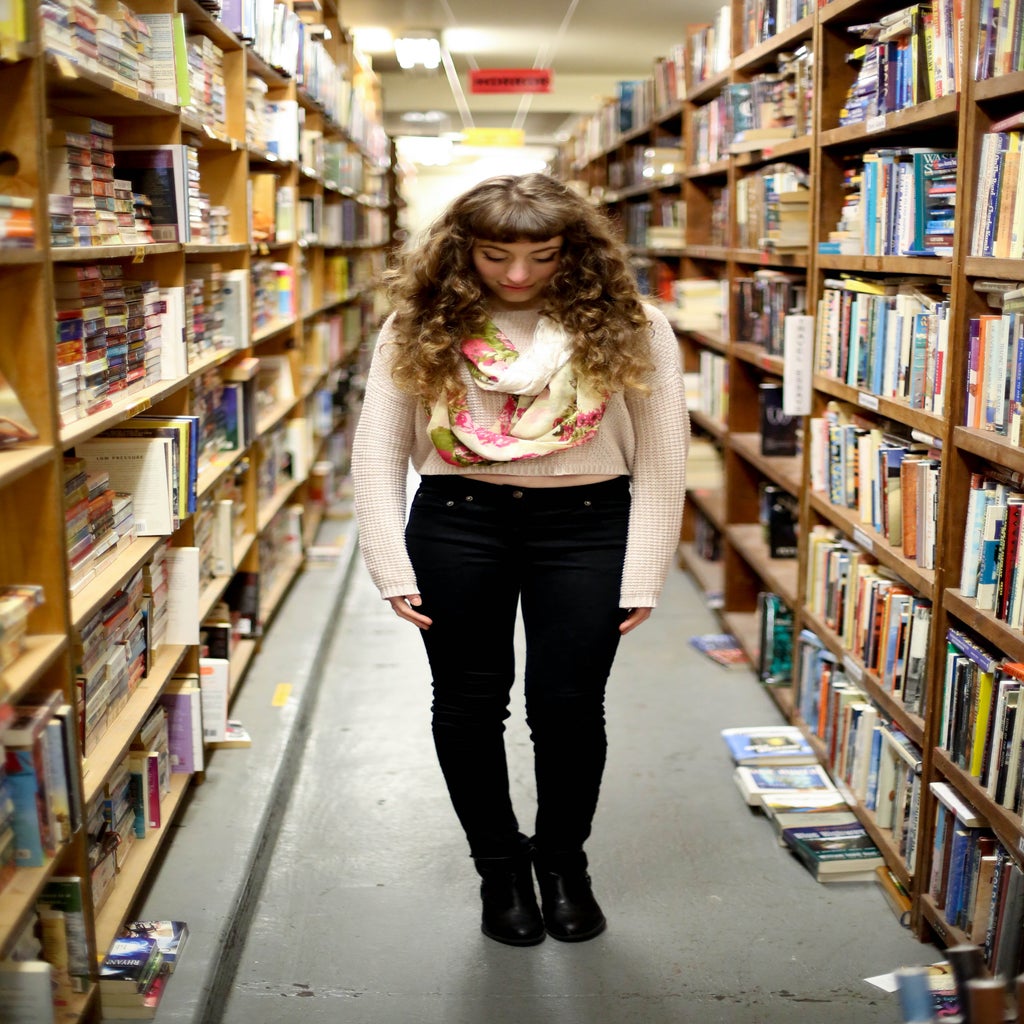 Girl In Library By Books