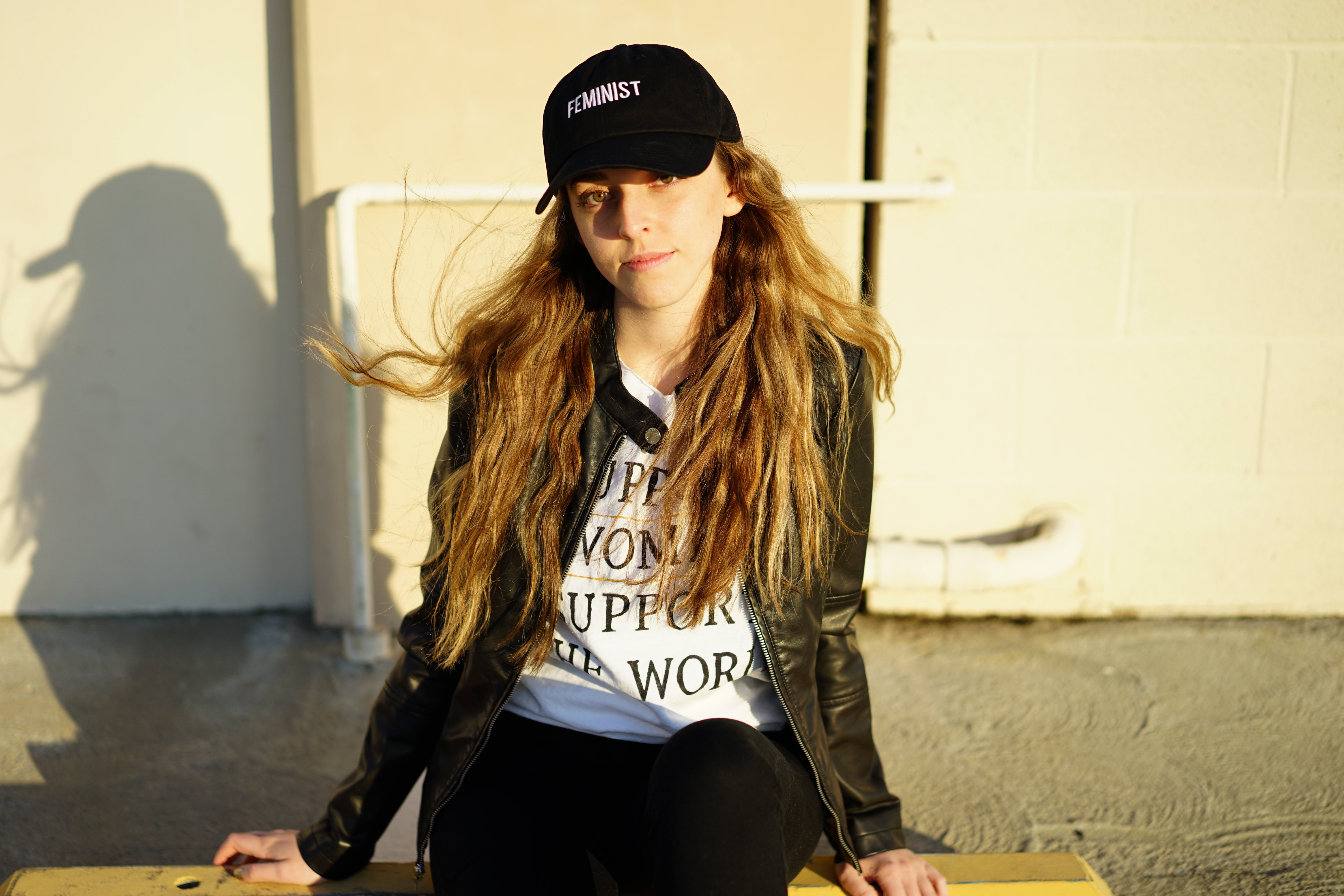 Laura Claypool feminist black baseball cap girl looking at you?width=1280&height=854&fit=crop&auto=webp&dpr=4