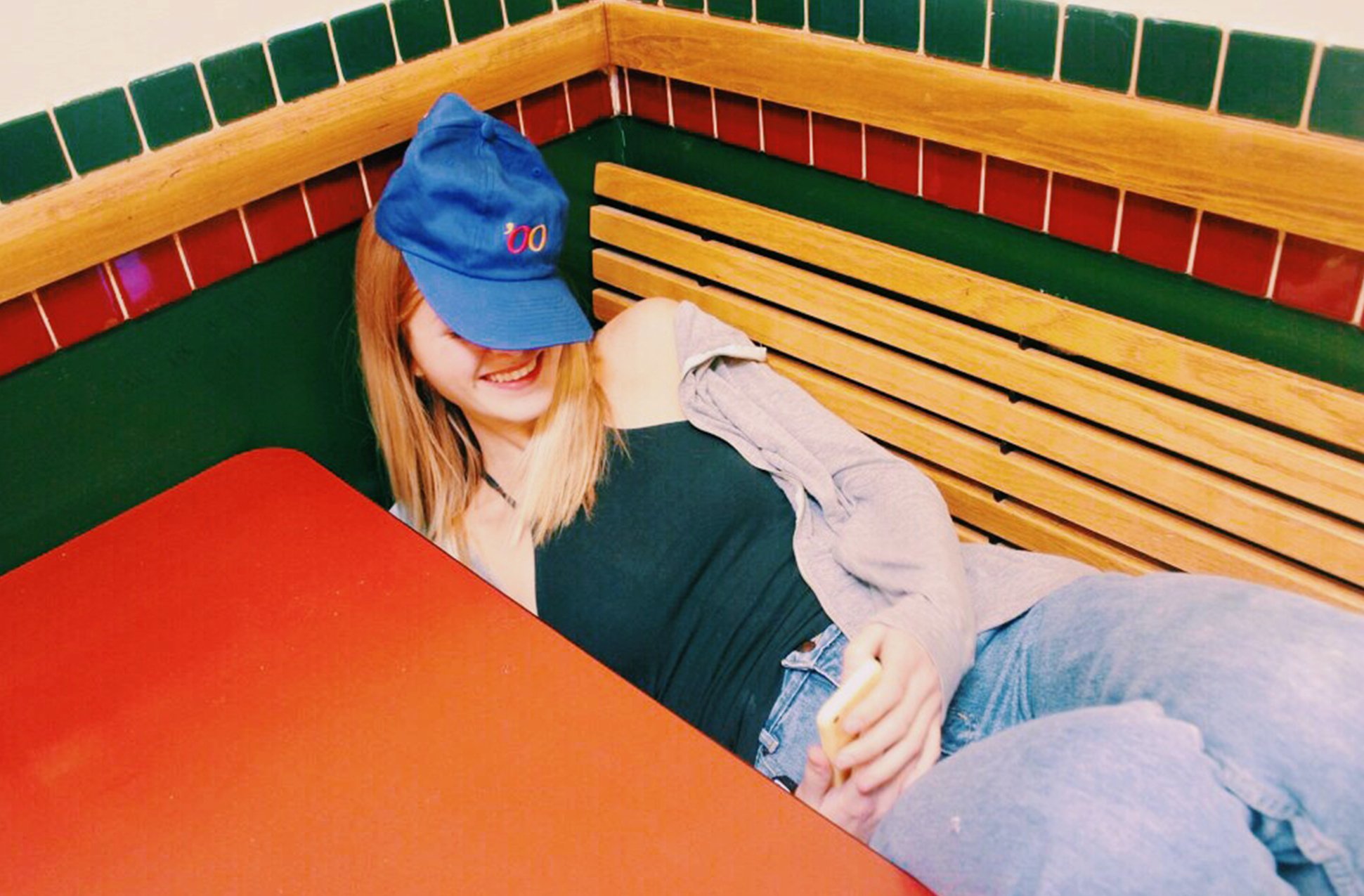 Anna Schultz-Girl In Hat Laughing In Food Court