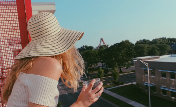Anna Schultz girl in sunhat looking off balcony?width=698&height=466&fit=crop&auto=webp&dpr=4