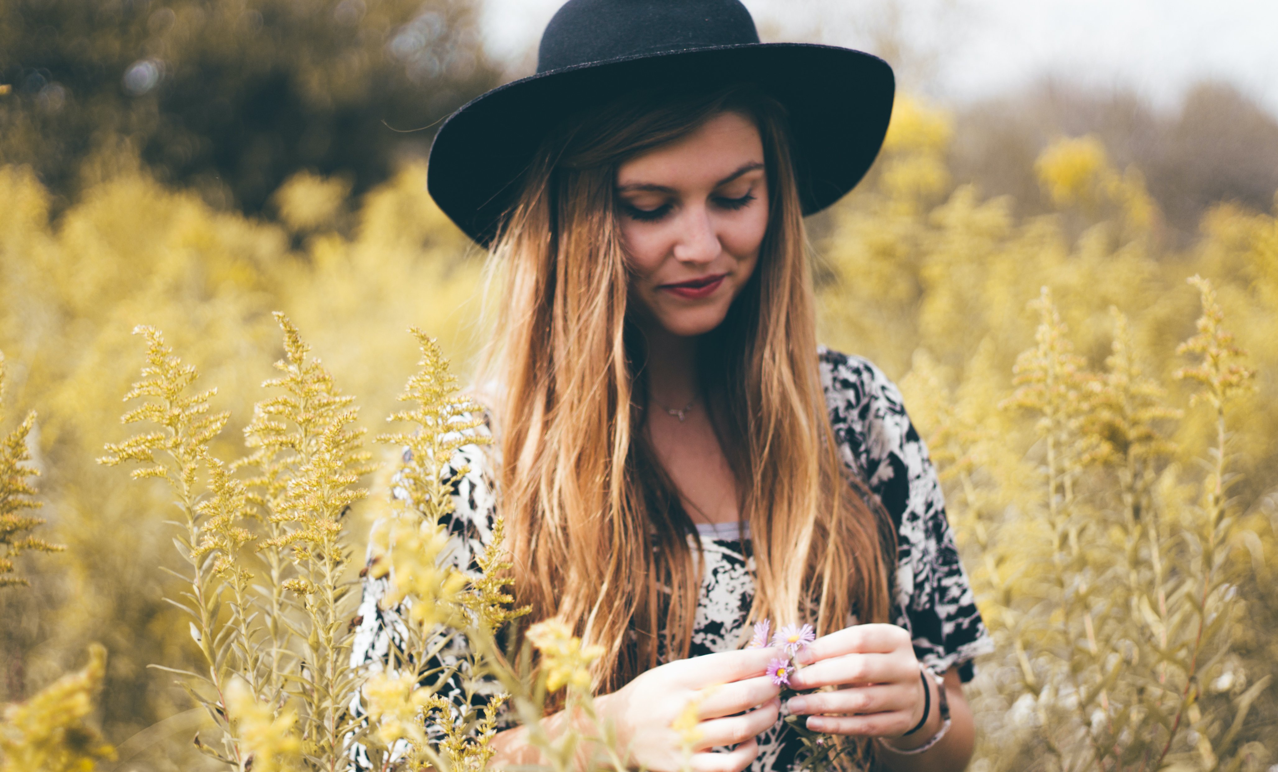 Girl Looking At Flower