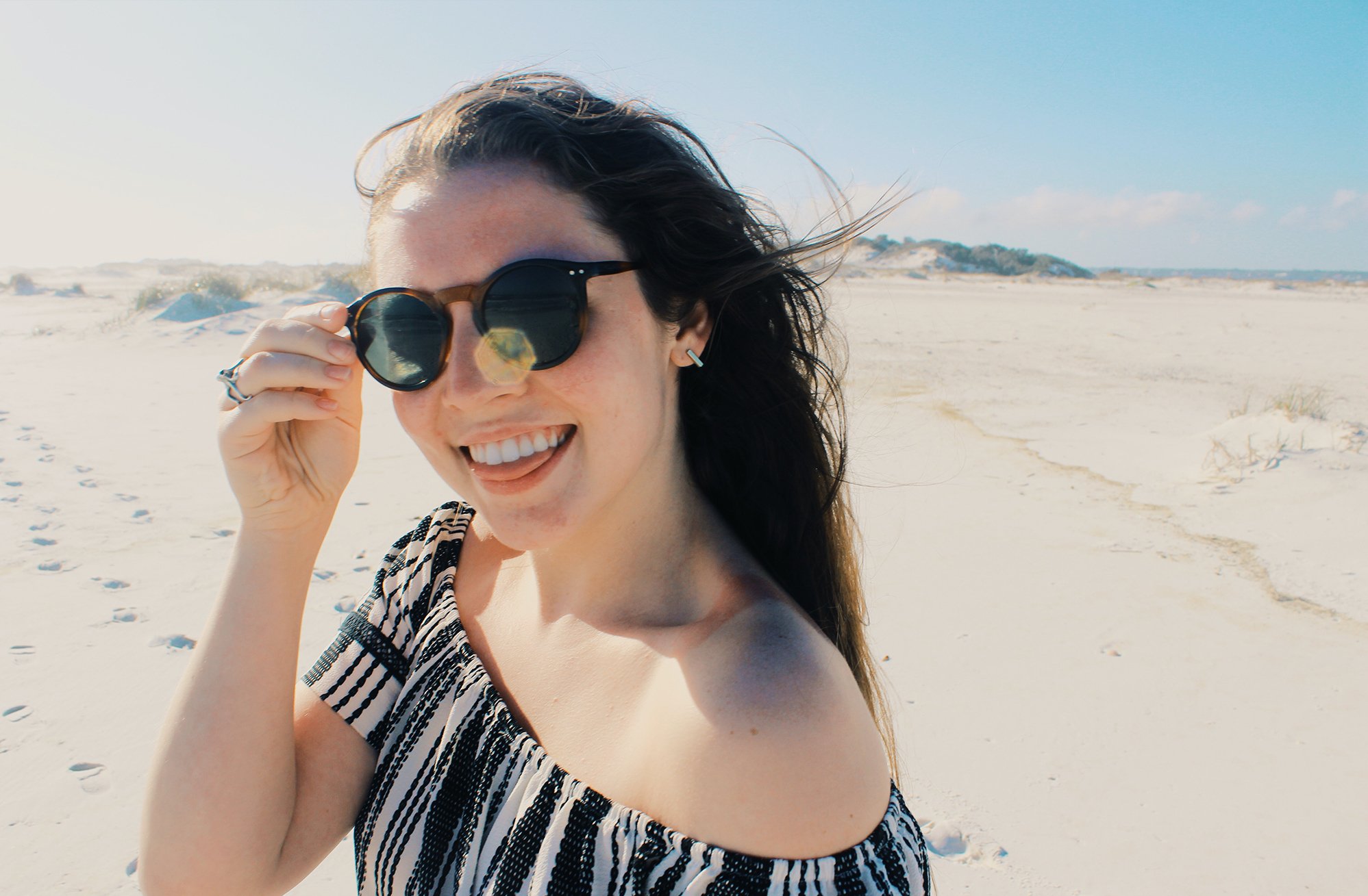 Anna Schultz happy girl in sunglasses on beach?width=698&height=466&fit=crop&auto=webp&dpr=4