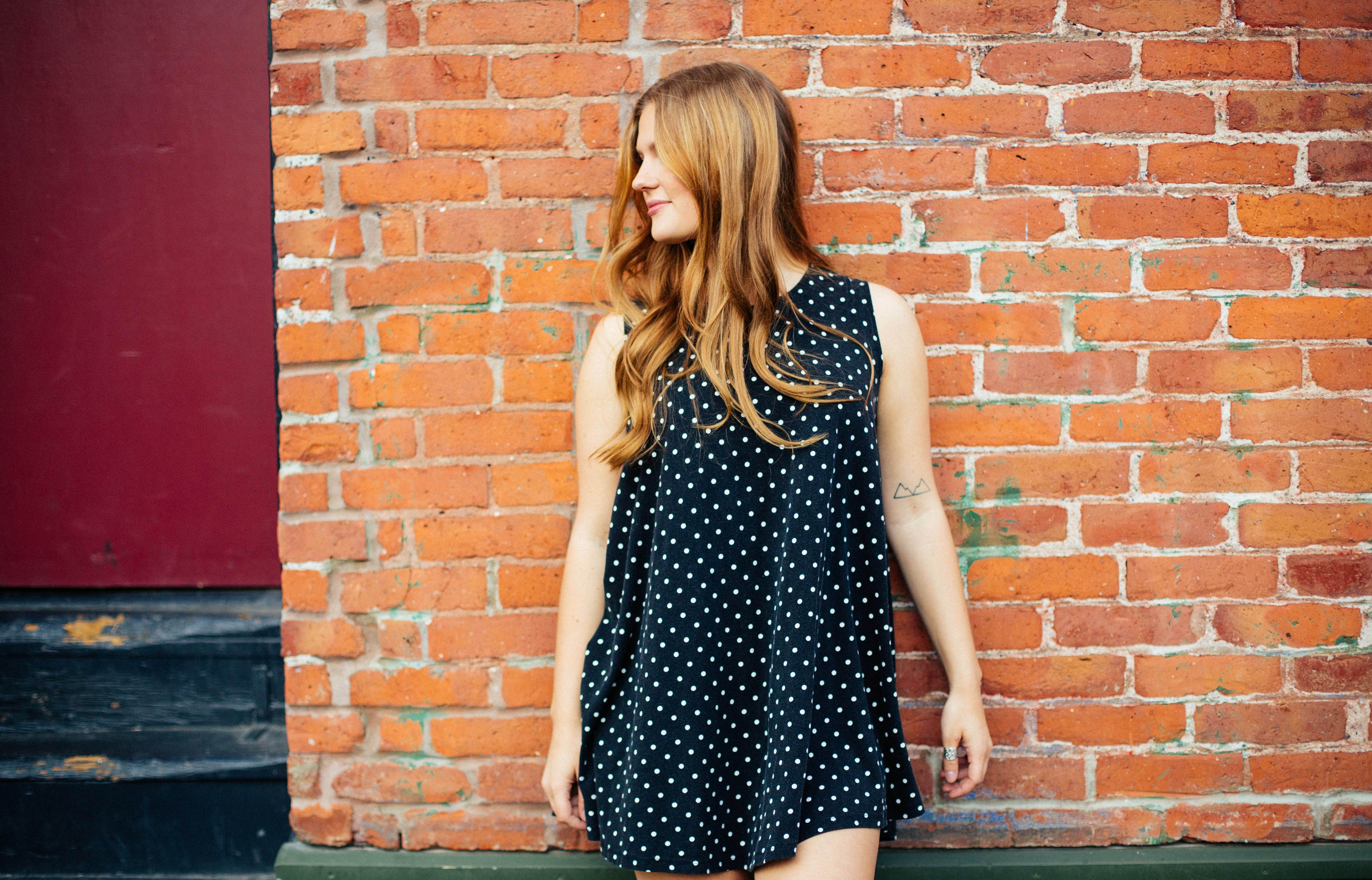 Girl Against Brick Wall