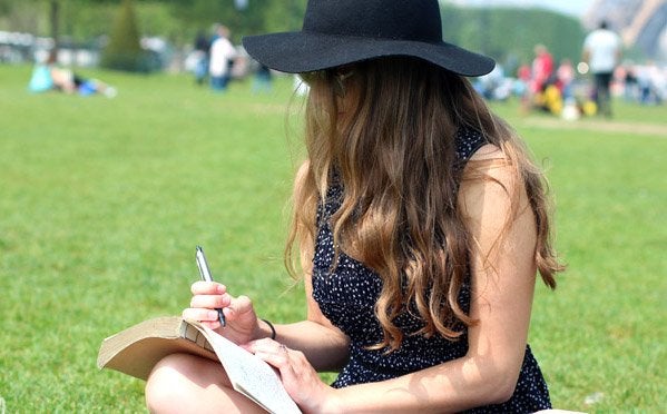 Kellyn Simpkin-Hat Girl Writing Book Grass Outside