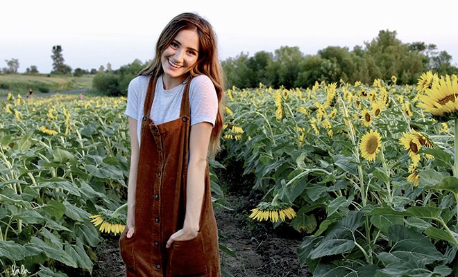 Maria Scheller brunette happy girl sunflower field dress hands in pockets?width=698&height=466&fit=crop&auto=webp&dpr=4